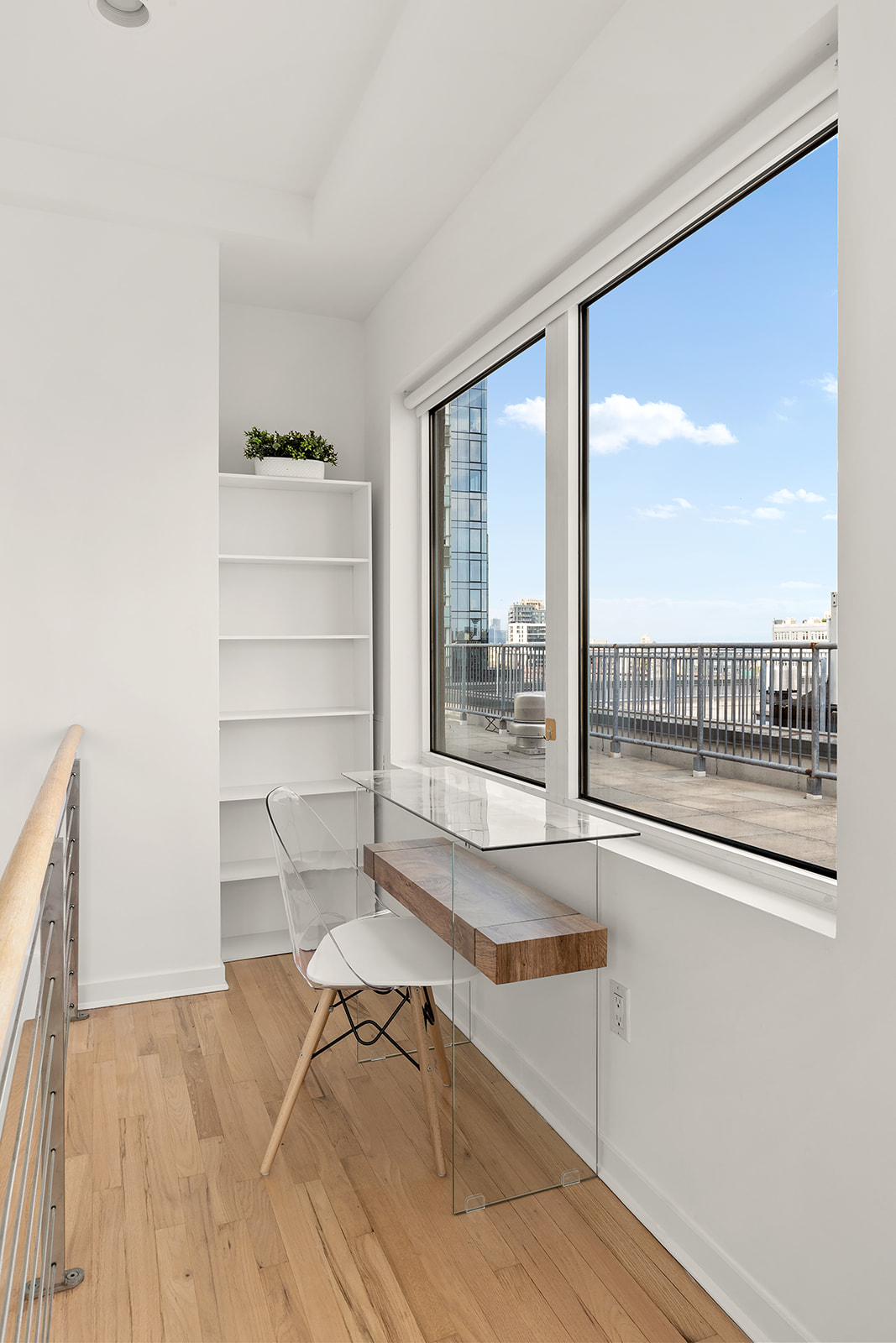 446 Kent Avenue, Unit PHC Brooklyn, NY 11249 - Photo 14 of 22 a room with a desk and chair