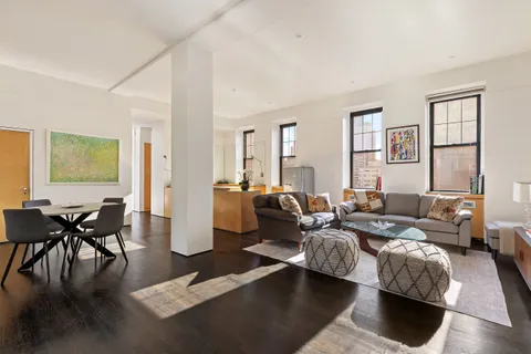 a living room with furniture rug and window