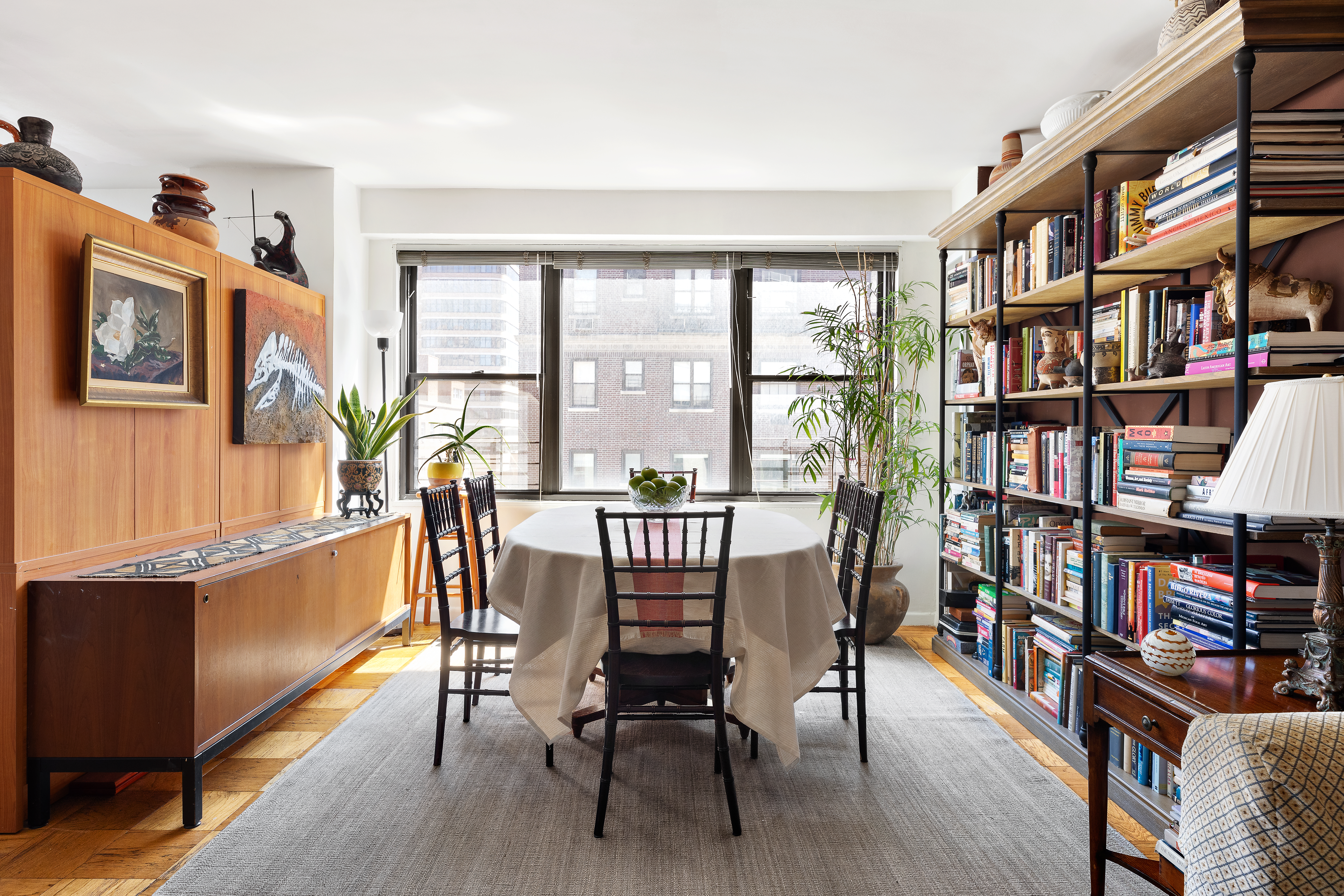 120 East 90th Street, Unit 9E Manhattan, NY 10128 - Photo 3 of 9 a view of a livingroom with furniture window and wooden floor