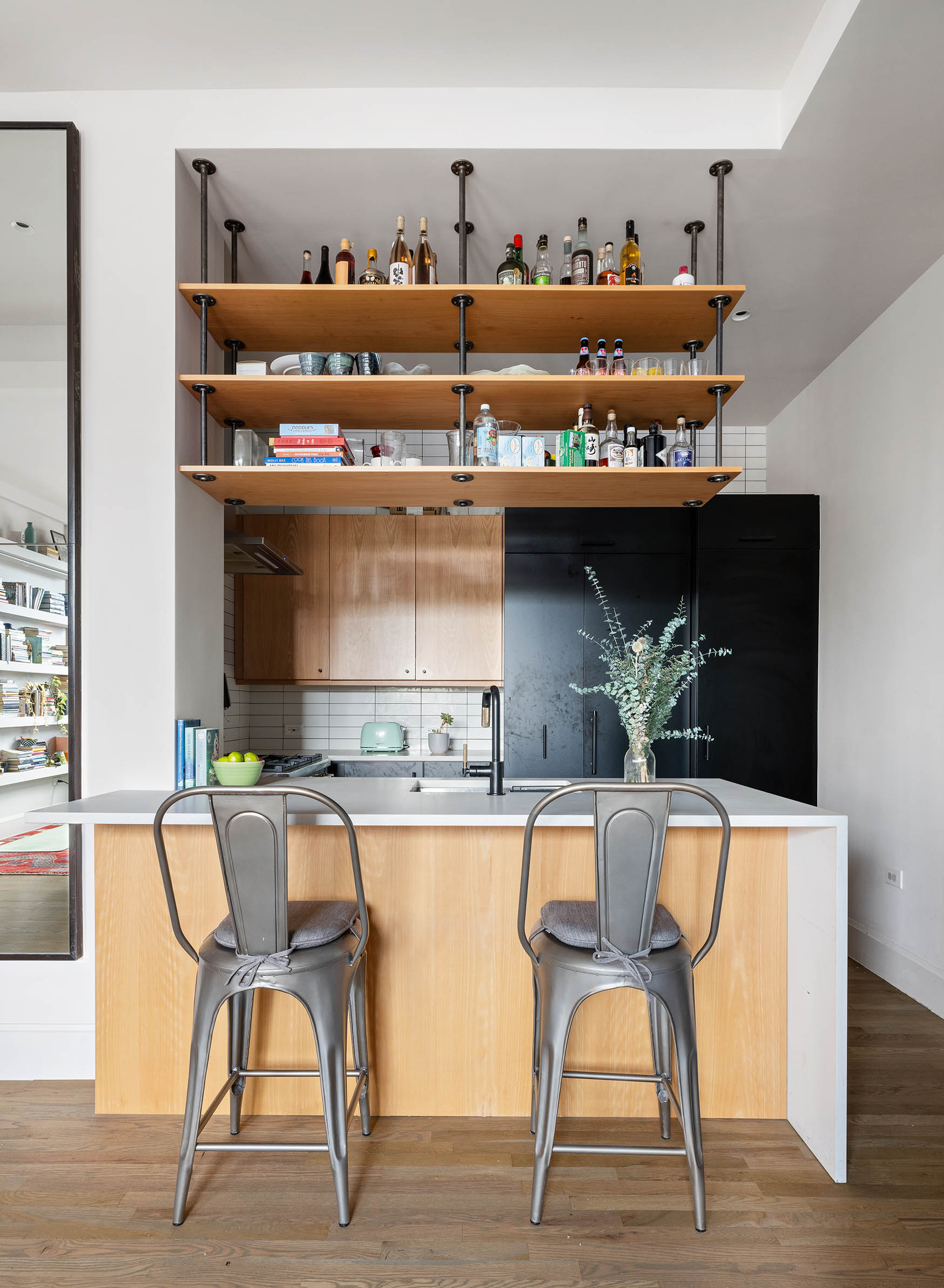 250 Mercer Street, Unit B1401 Manhattan, NY 10012 - Photo 3 of 8 a dining room filled with furniture and wooden floor
