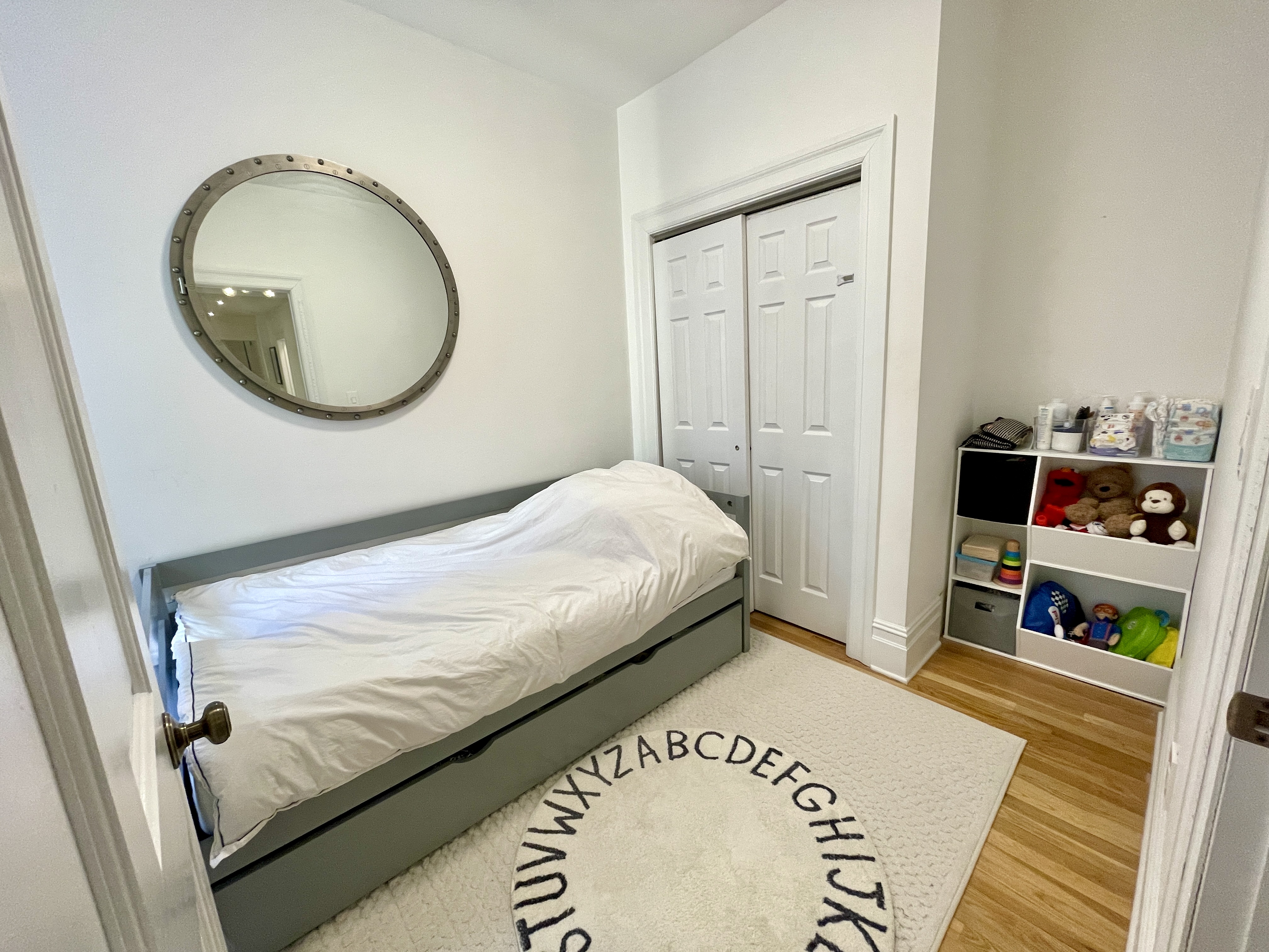 203 West 90th Street, Unit 6B Manhattan, NY 10024 - Photo 12 of 22 a bedroom with a bed and a mirror
