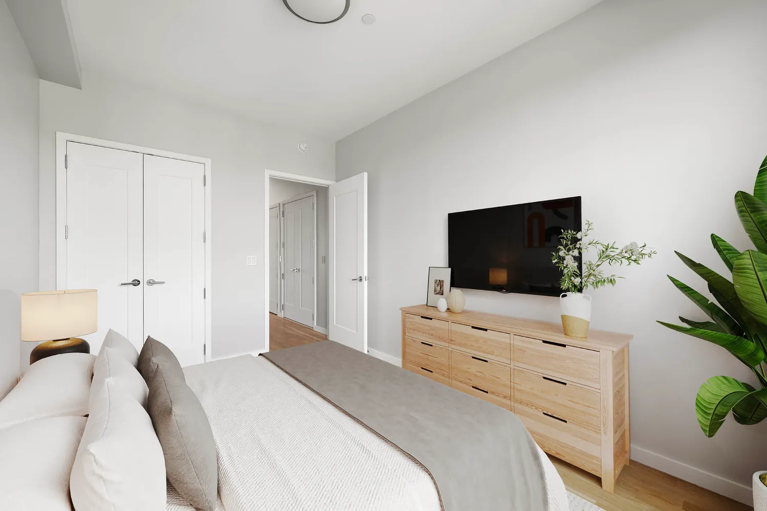 a view of an empty room with wooden floor