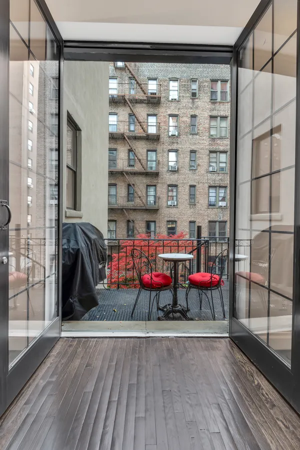 a view of front door with outdoor seating