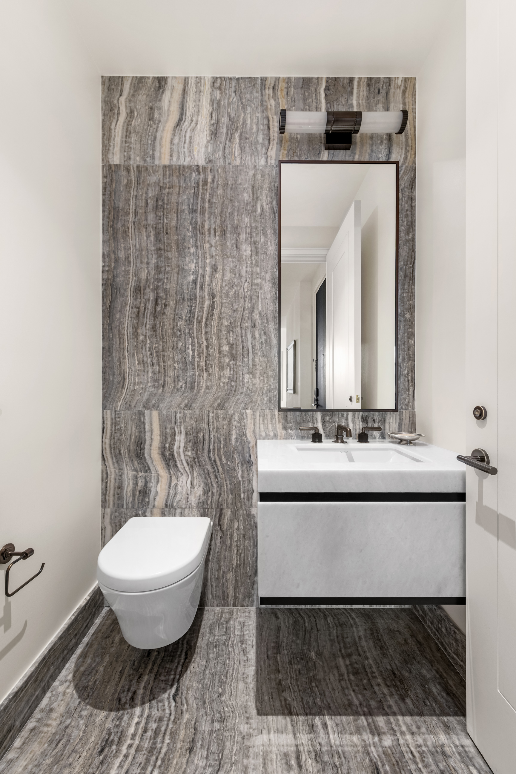 515 West 18th Street, Unit 1102 Manhattan, NY 10011 - Photo 16 of 18 a bathroom with a toilet a sink and mirror