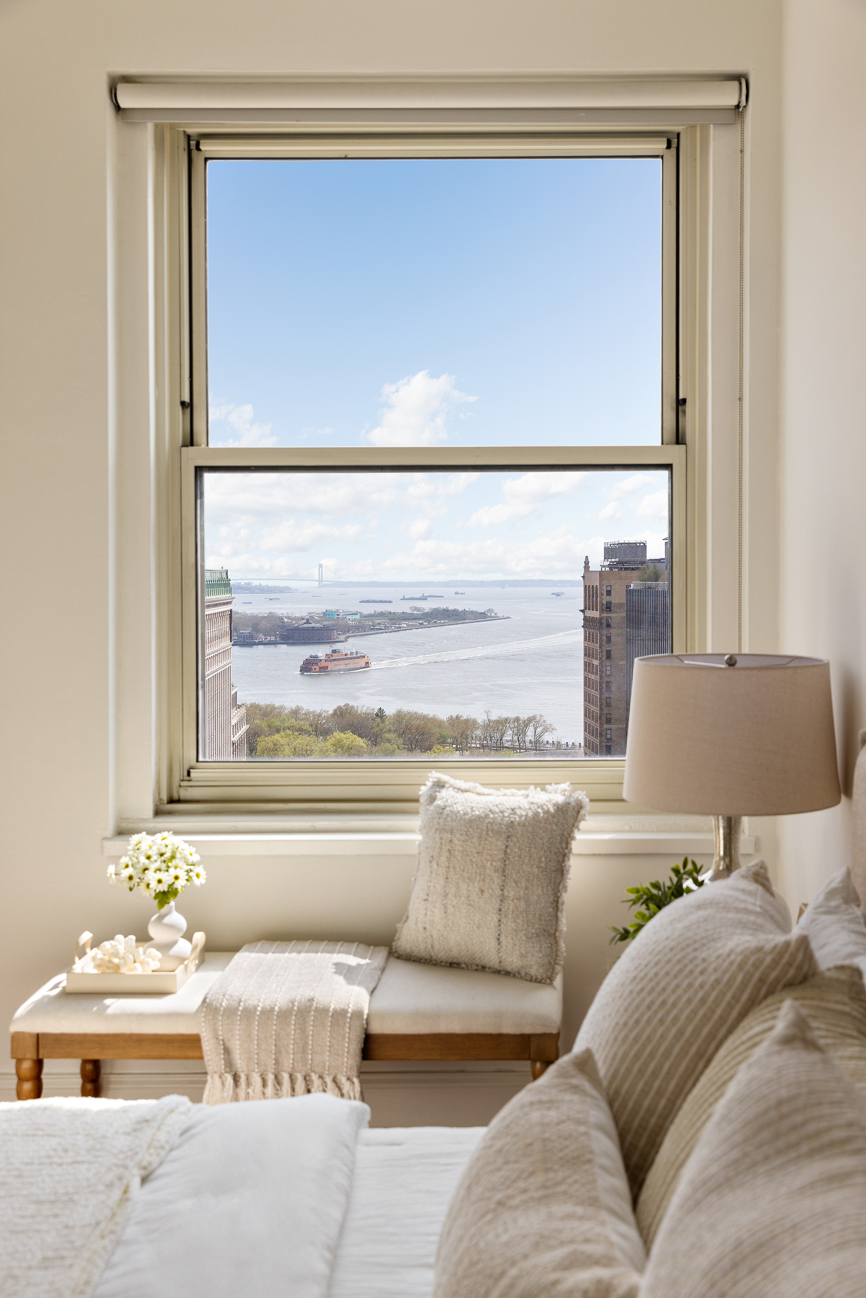 88 Greenwich Street, Unit 2206 Manhattan, NY 10006 - Photo 5 of 16 a living room with furniture and a window