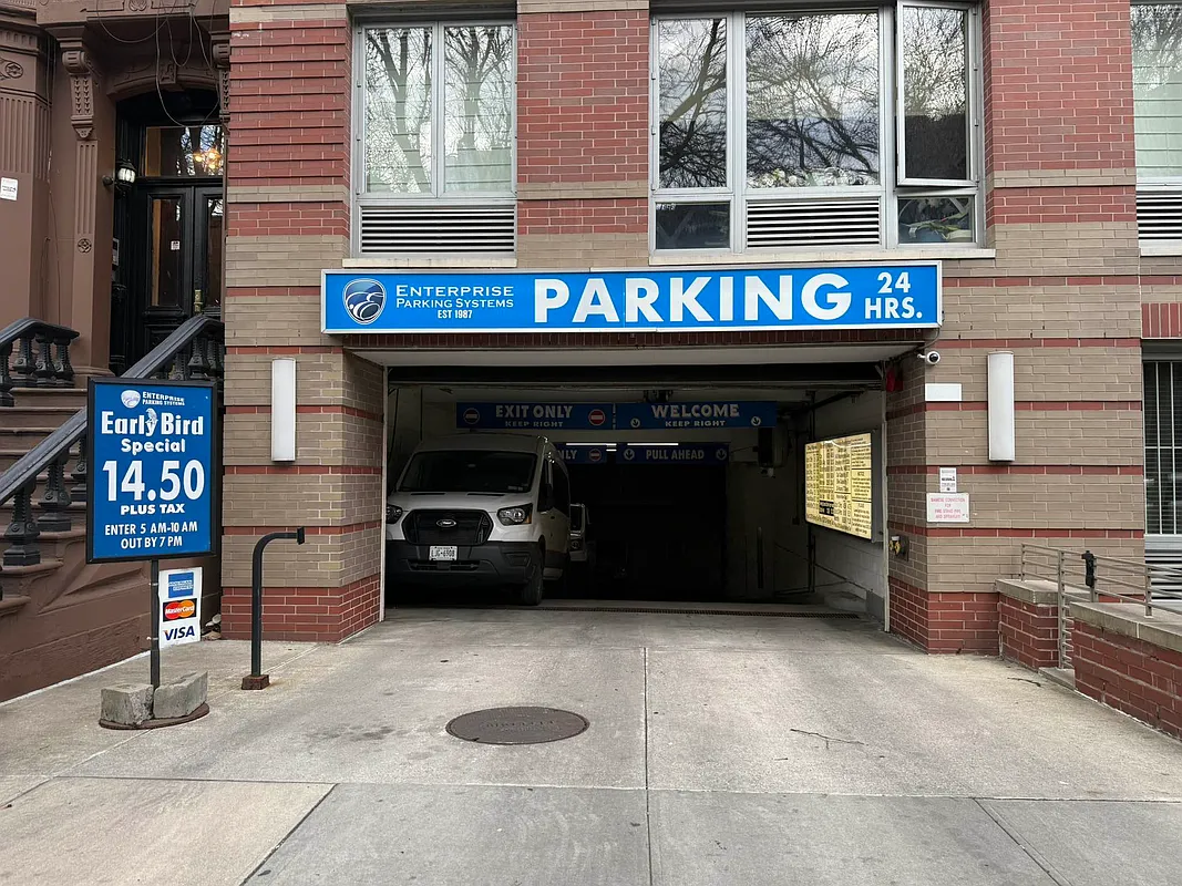 545 Washington Avenue, Unit 508 Brooklyn, NY 11238 - Photo 15 of 16 a front view of a building with parking
