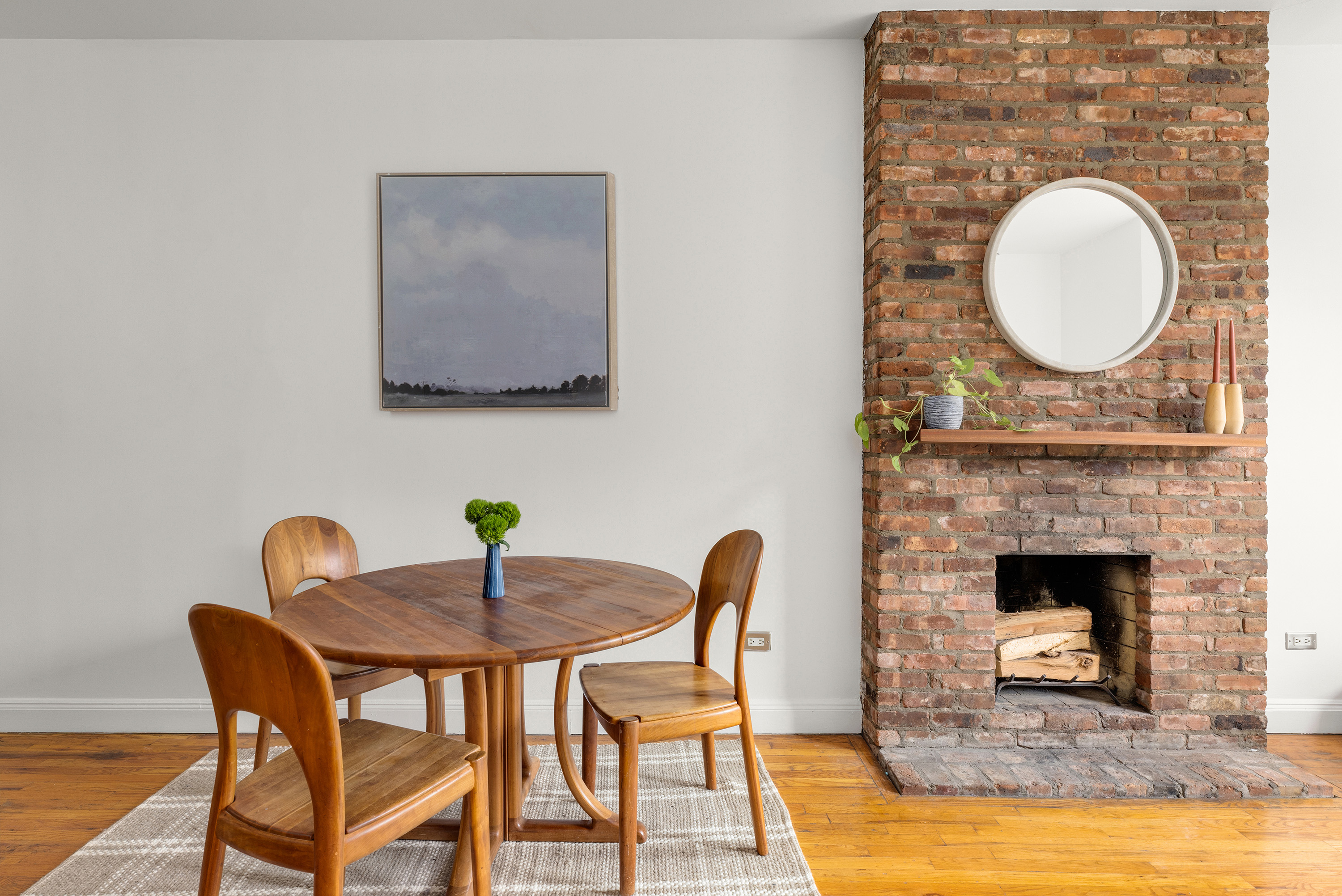 315 3rd Street, Unit 2A Brooklyn, NY 11215 - Photo 2 of 8 a dining room with furniture a fireplace and wooden floor