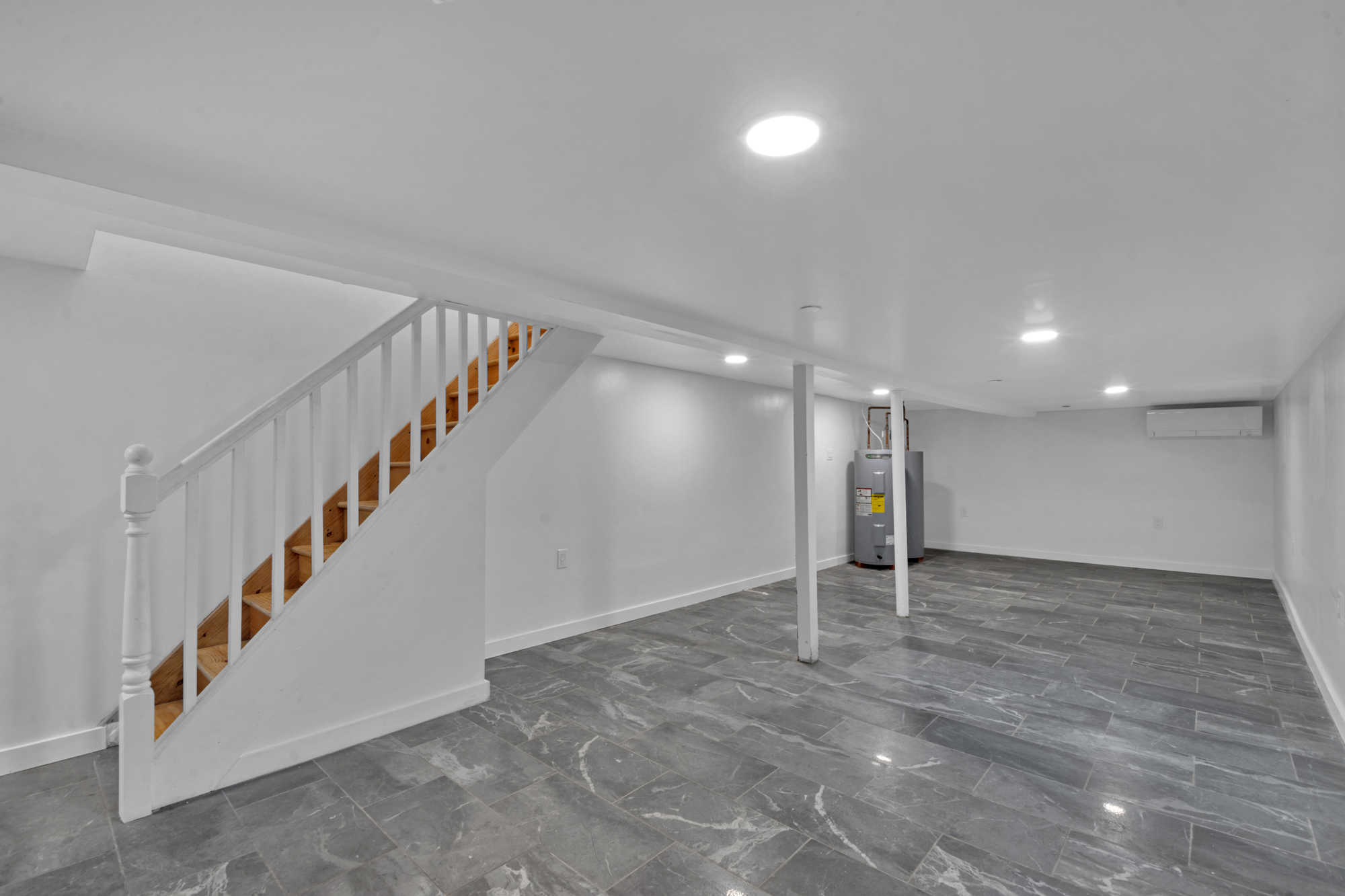 31 Roosevelt Place, Unit 1A Brooklyn, NY 11233 - Photo 9 of 14 a view of an empty room with stairs