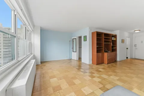 a view of an empty room with a window