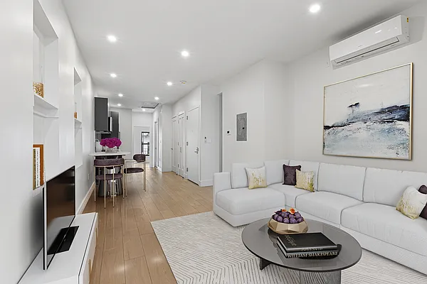 352 Palmetto Street, Unit 1R Brooklyn, NY 11237 - Photo 1 of 13 a living room with furniture and a wooden floor