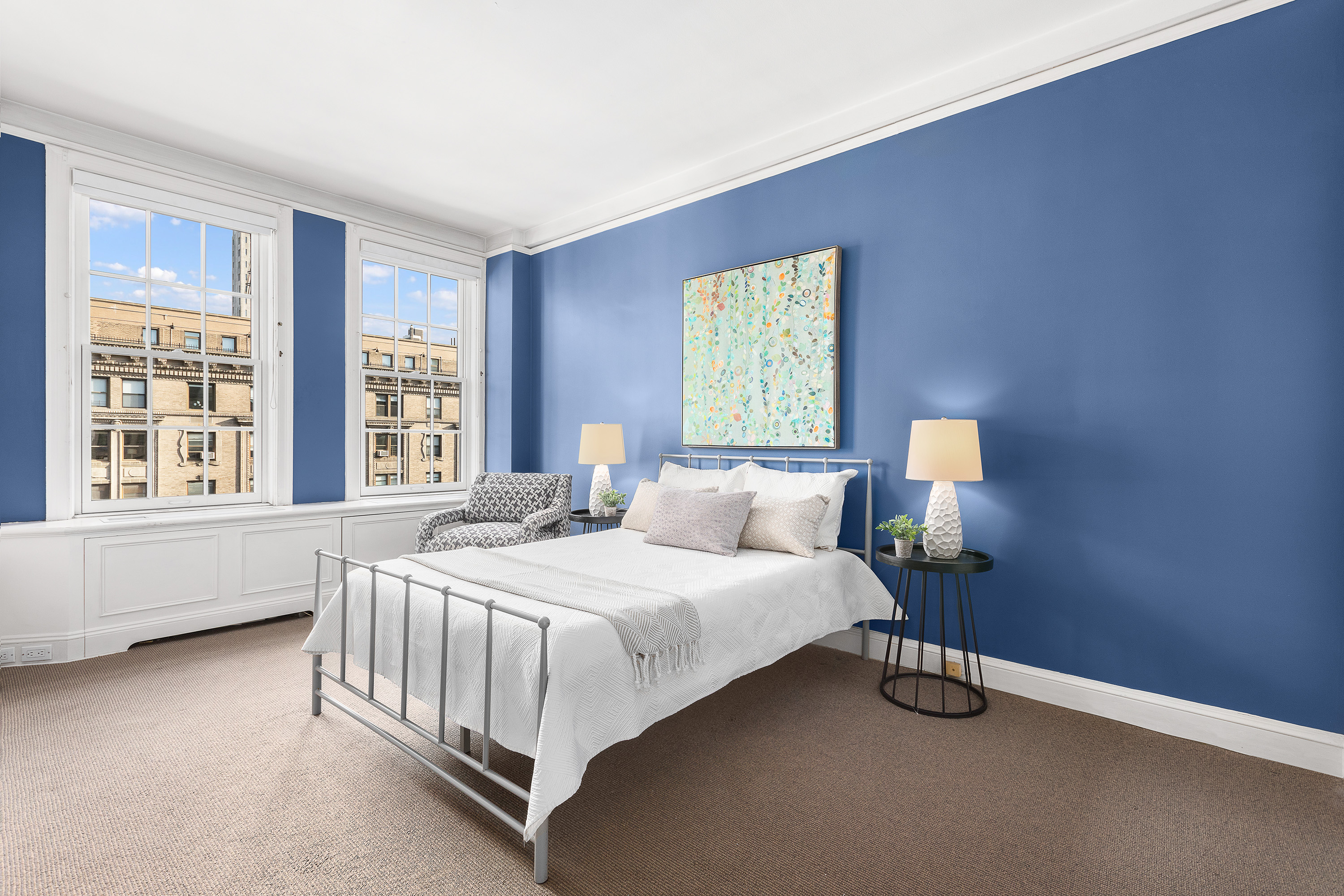 1088 Park Avenue, Unit 15C Manhattan, NY 10128 - Photo 12 of 26 a bedroom with a bed lamp and window