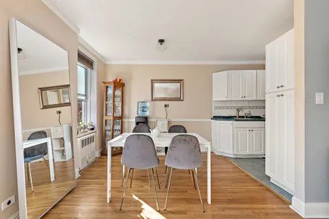 a view of kitchen with cabinets and wooden floor