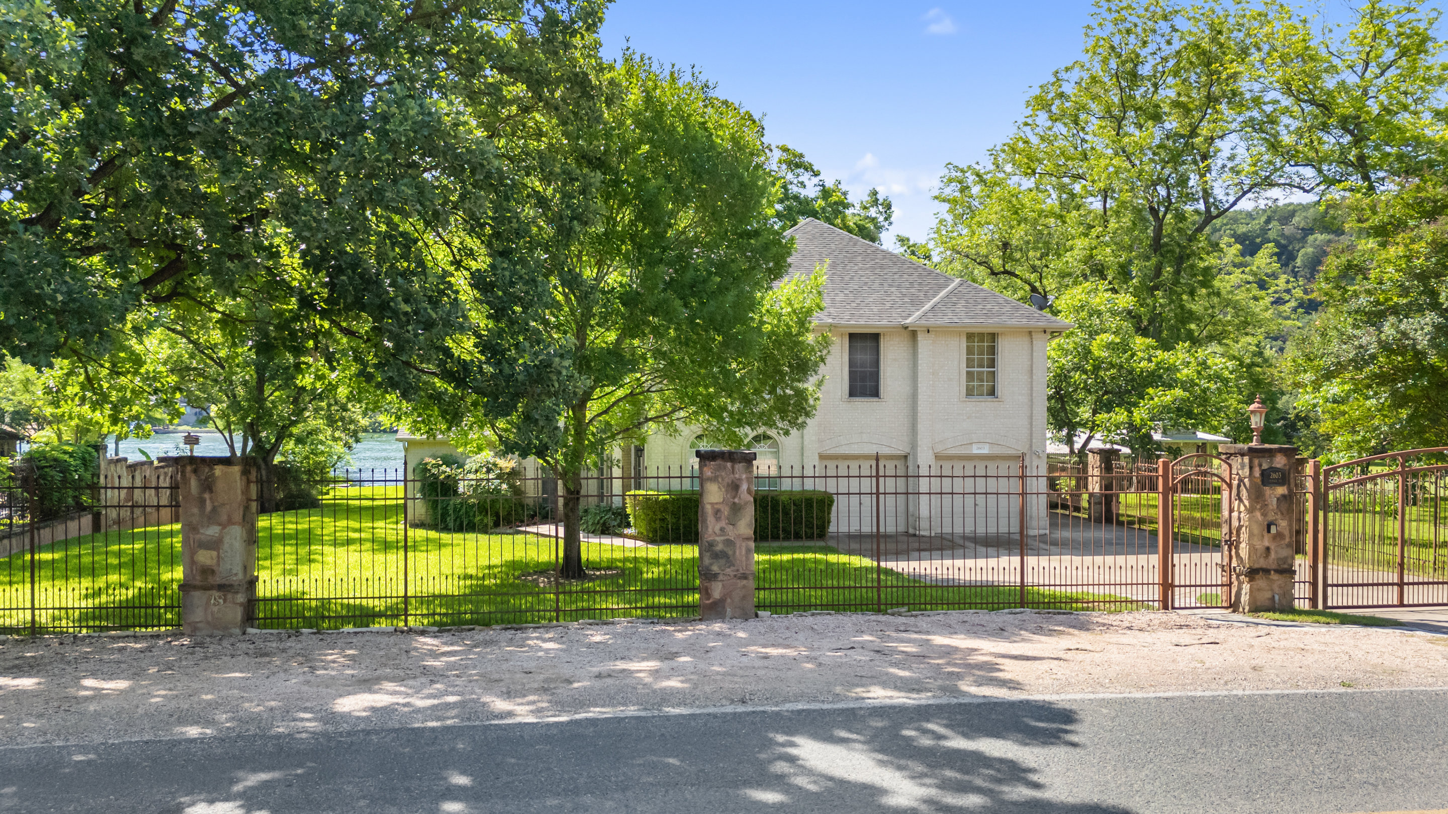2603 Pearce Road Austin, TX 78730 - Photo 29 of 41 a view of a house with a backyard and a tree