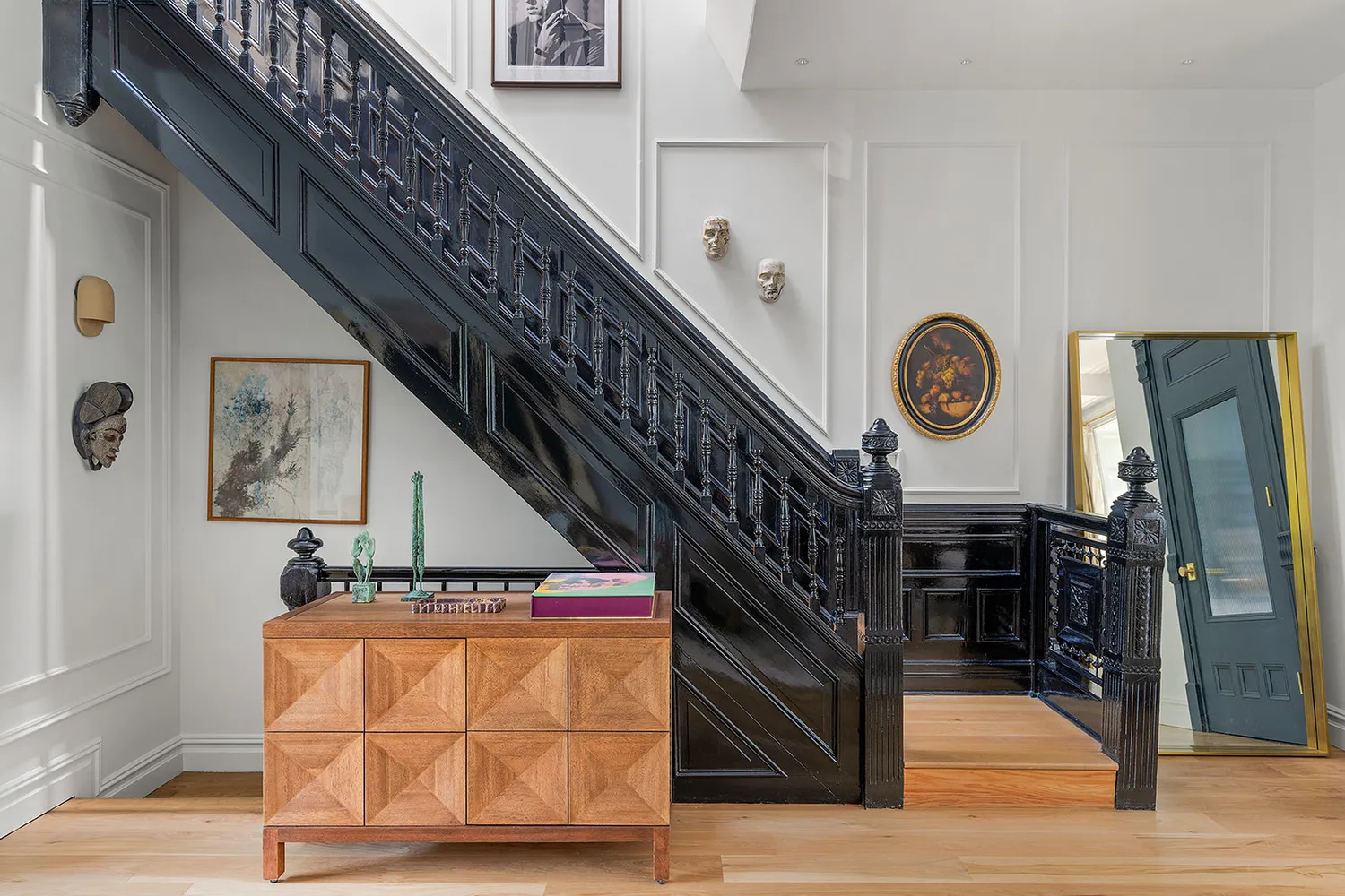 a view of an entryway with wooden floor