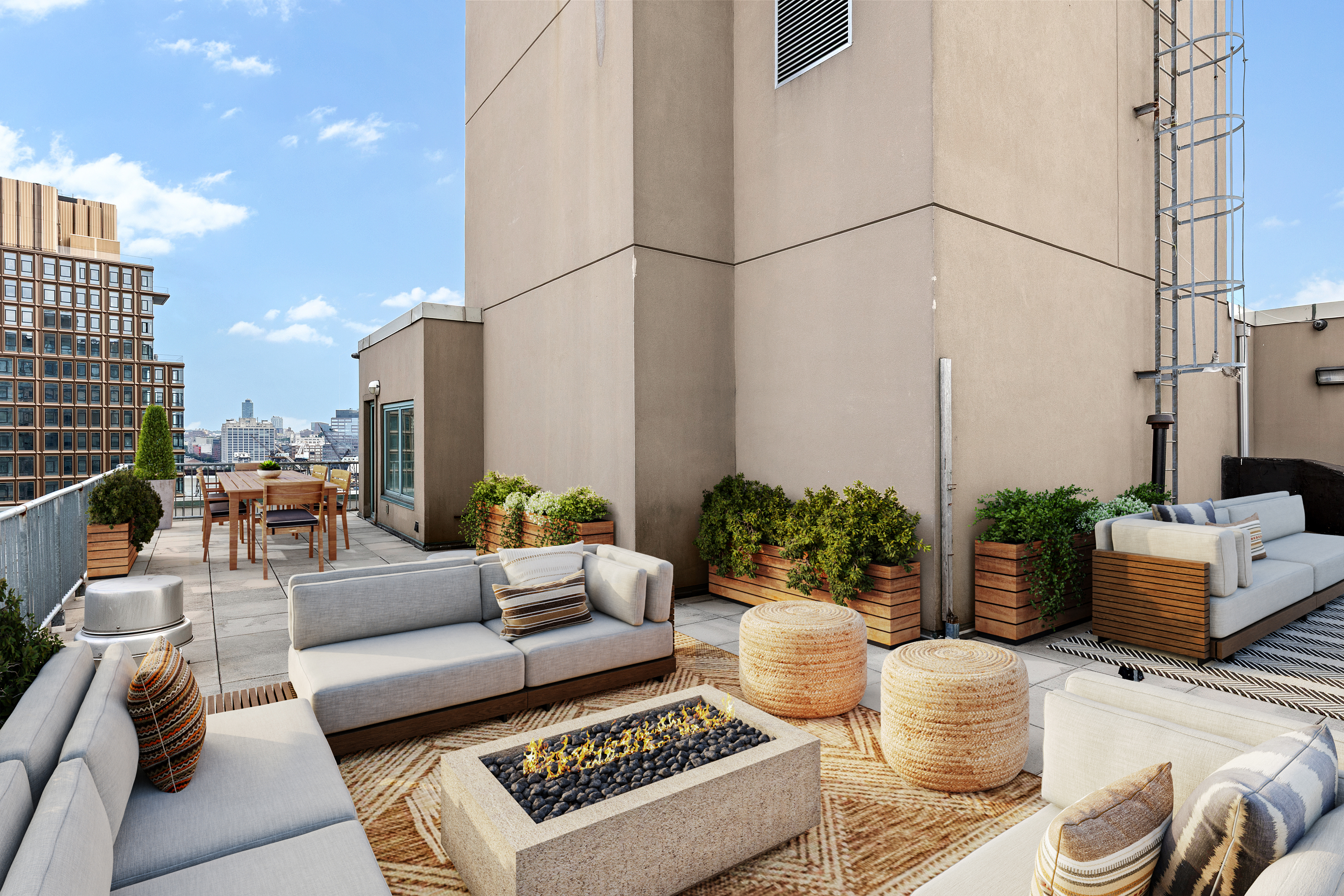 446 Kent Avenue, Unit PHC Brooklyn, NY 11249 - Photo 17 of 22 a view of a patio with couches and potted plants