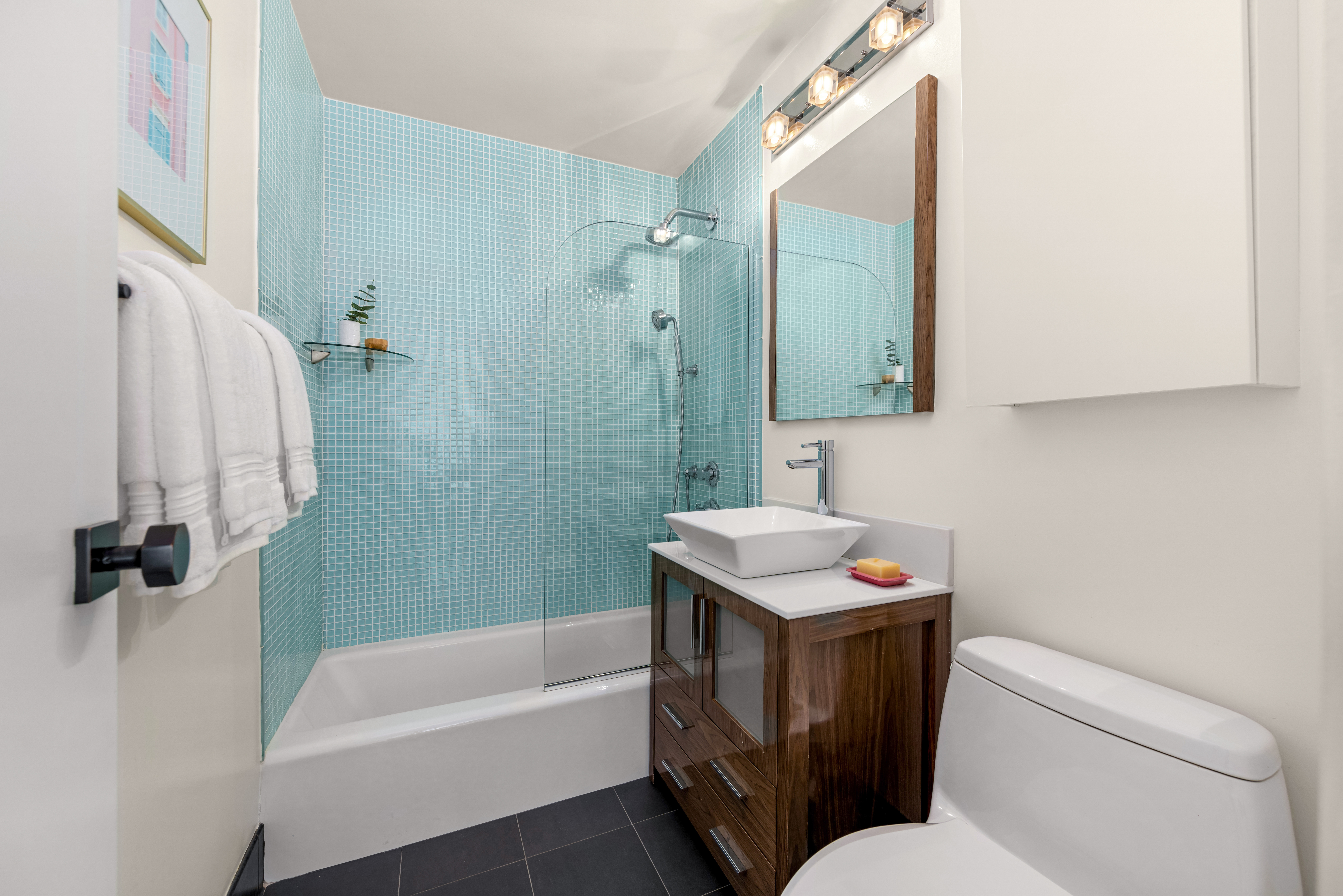 115 East 9th Street, Unit 8E Manhattan, NY 10003 - Photo 10 of 16 a bathroom with a sink toilet and shower