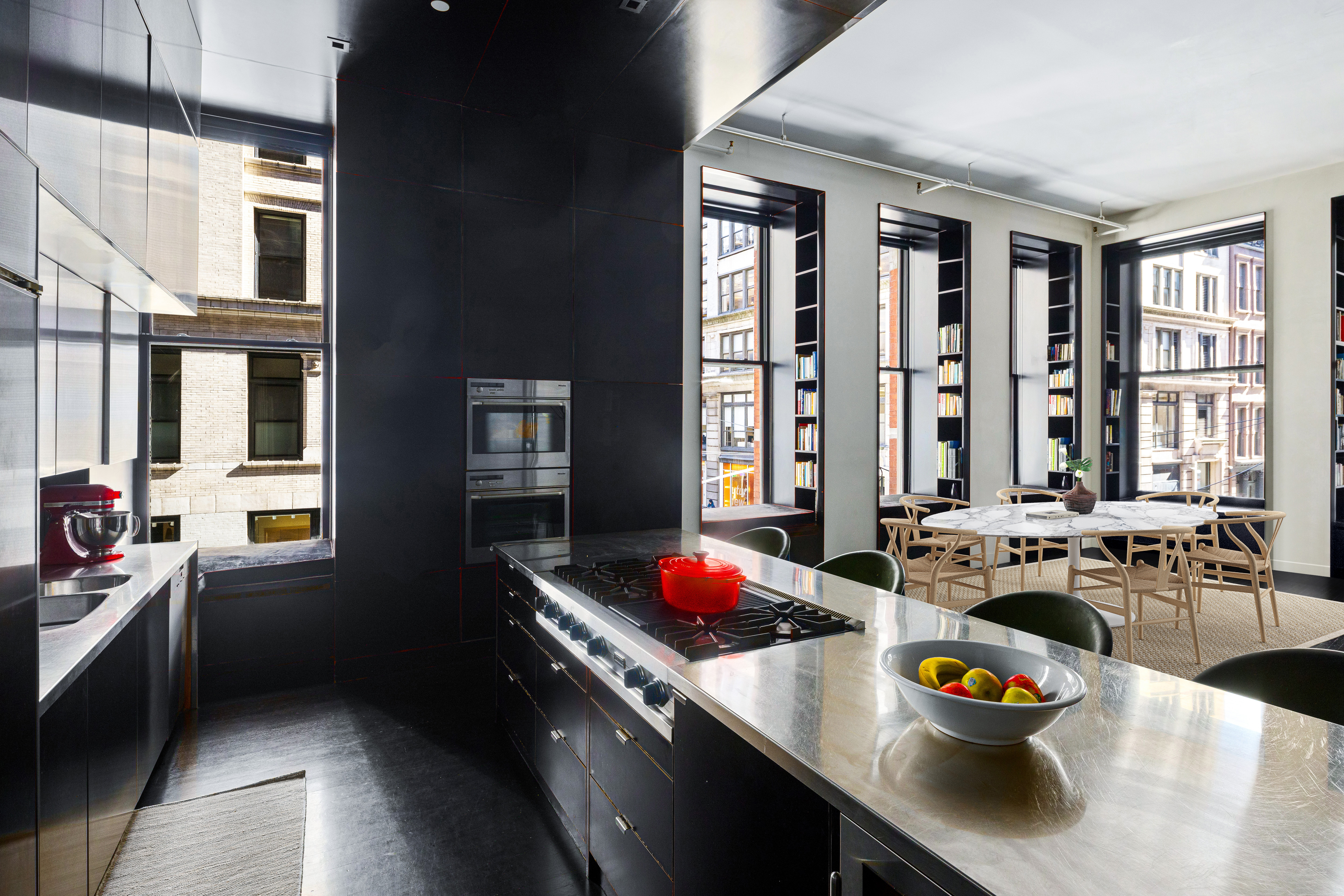 76 Crosby Street, Unit 2B Manhattan, NY 10012 - Photo 4 of 17 a kitchen with a sink stove and cabinets