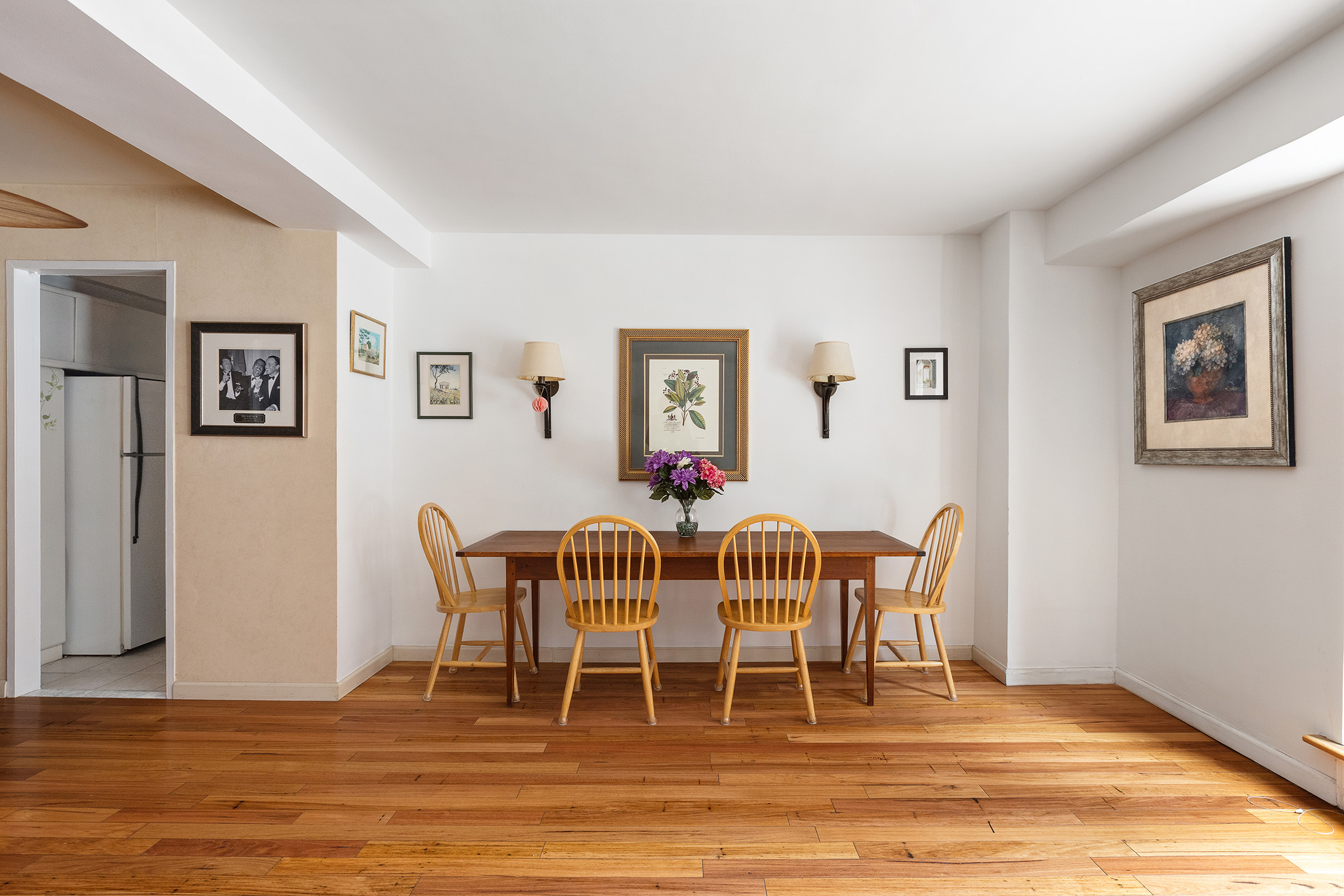 310 Lexington Avenue, Unit 1B Manhattan, NY 10016 - Photo 2 of 10 a dining room with furniture and wooden floor