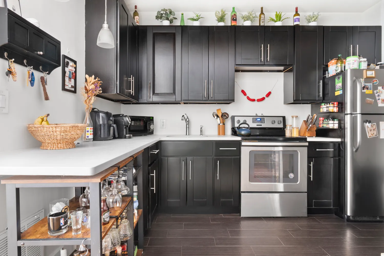 a kitchen with stainless steel appliances granite countertop a refrigerator and a sink