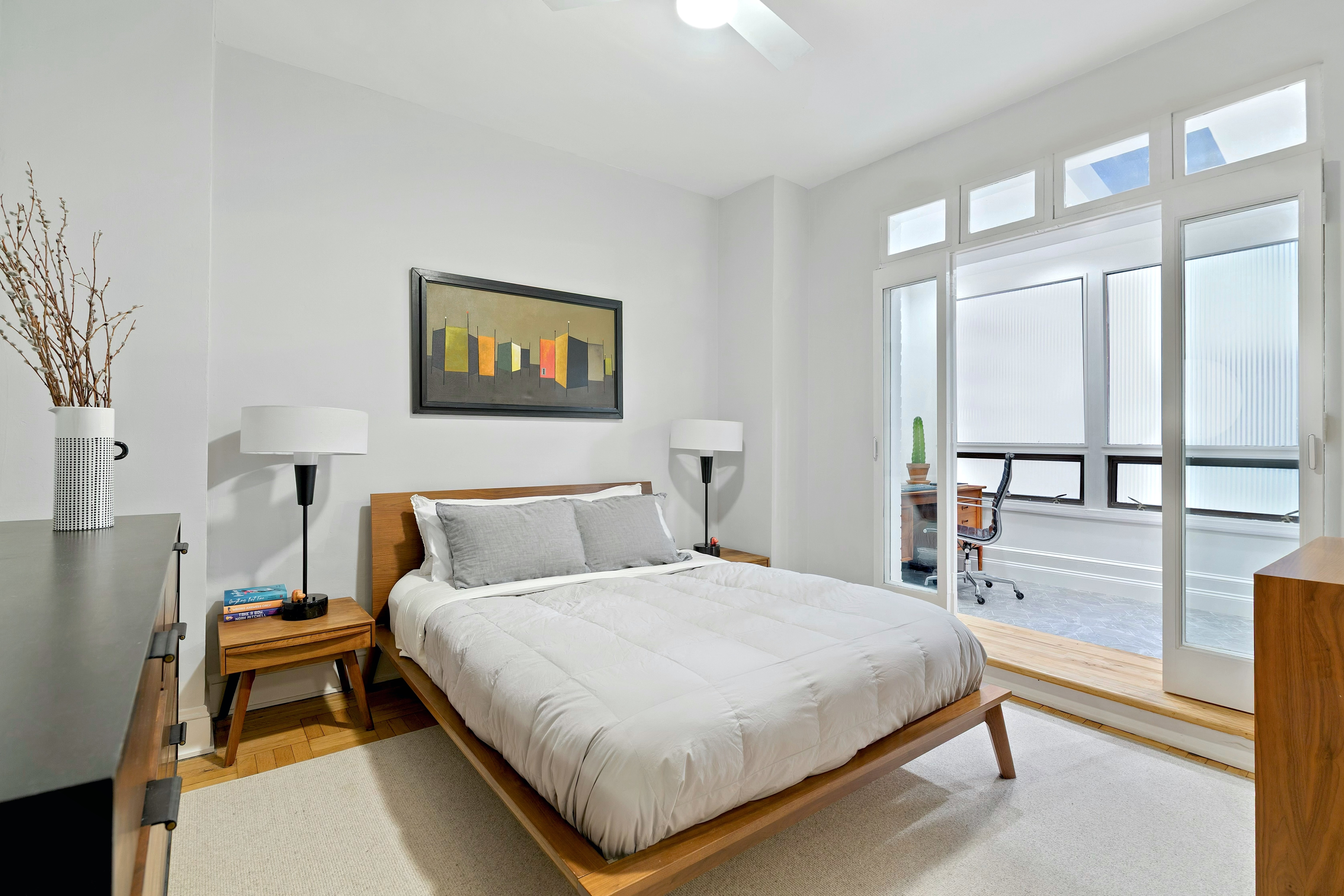 40 West 67th Street, Unit 1A Manhattan, NY 10023 - Photo 8 of 17 a bedroom with a bed and a large window