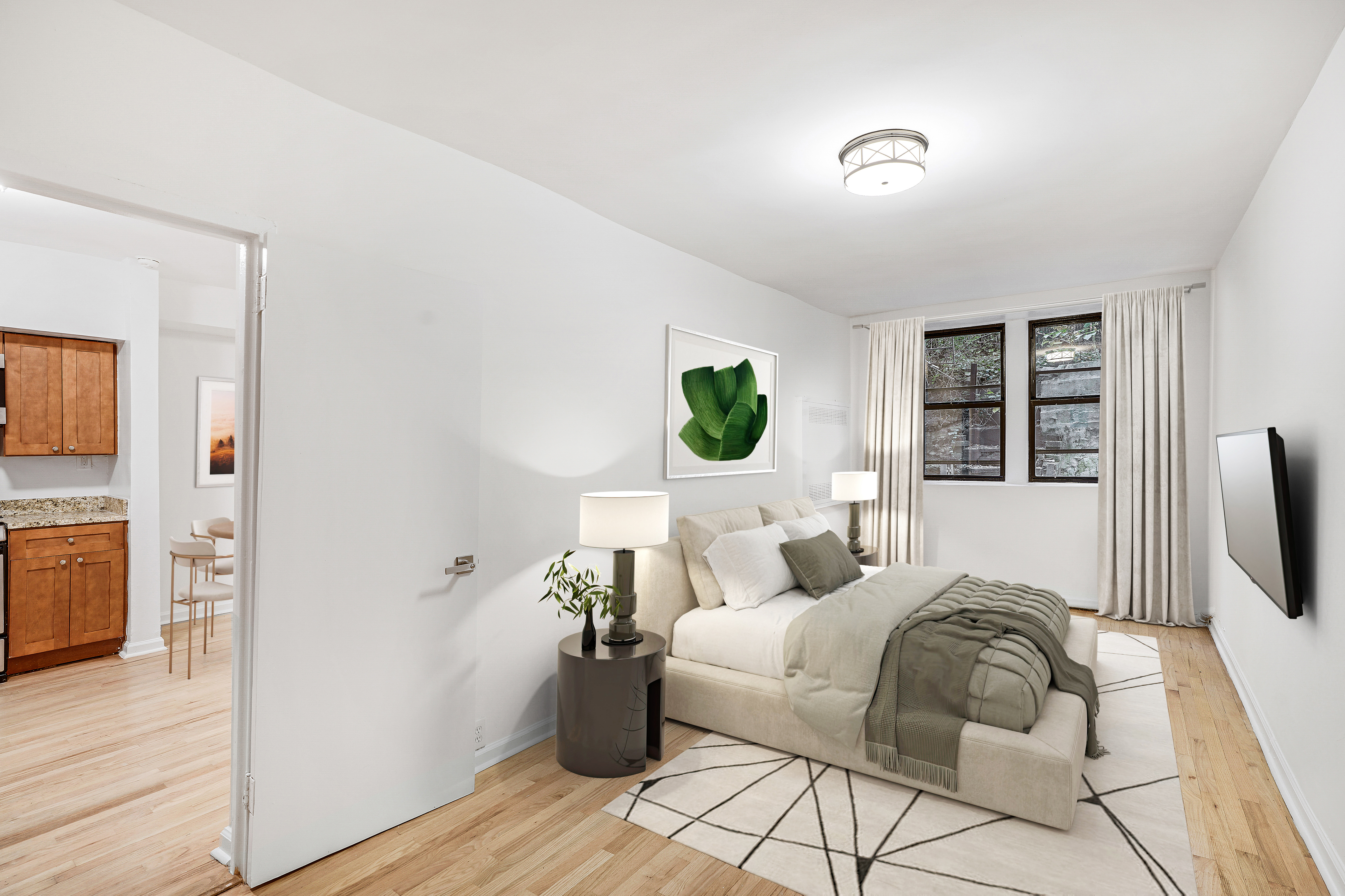 433 East 82nd Street, Unit 2B Manhattan, NY 10028 - Photo 4 of 5 a bedroom with a bed and wooden floor