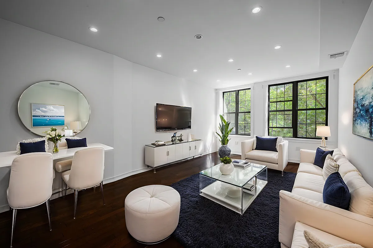 877 Greene Avenue, Unit 2 Brooklyn, NY 11221 - Photo 1 of 13 a living room with furniture and a flat screen tv