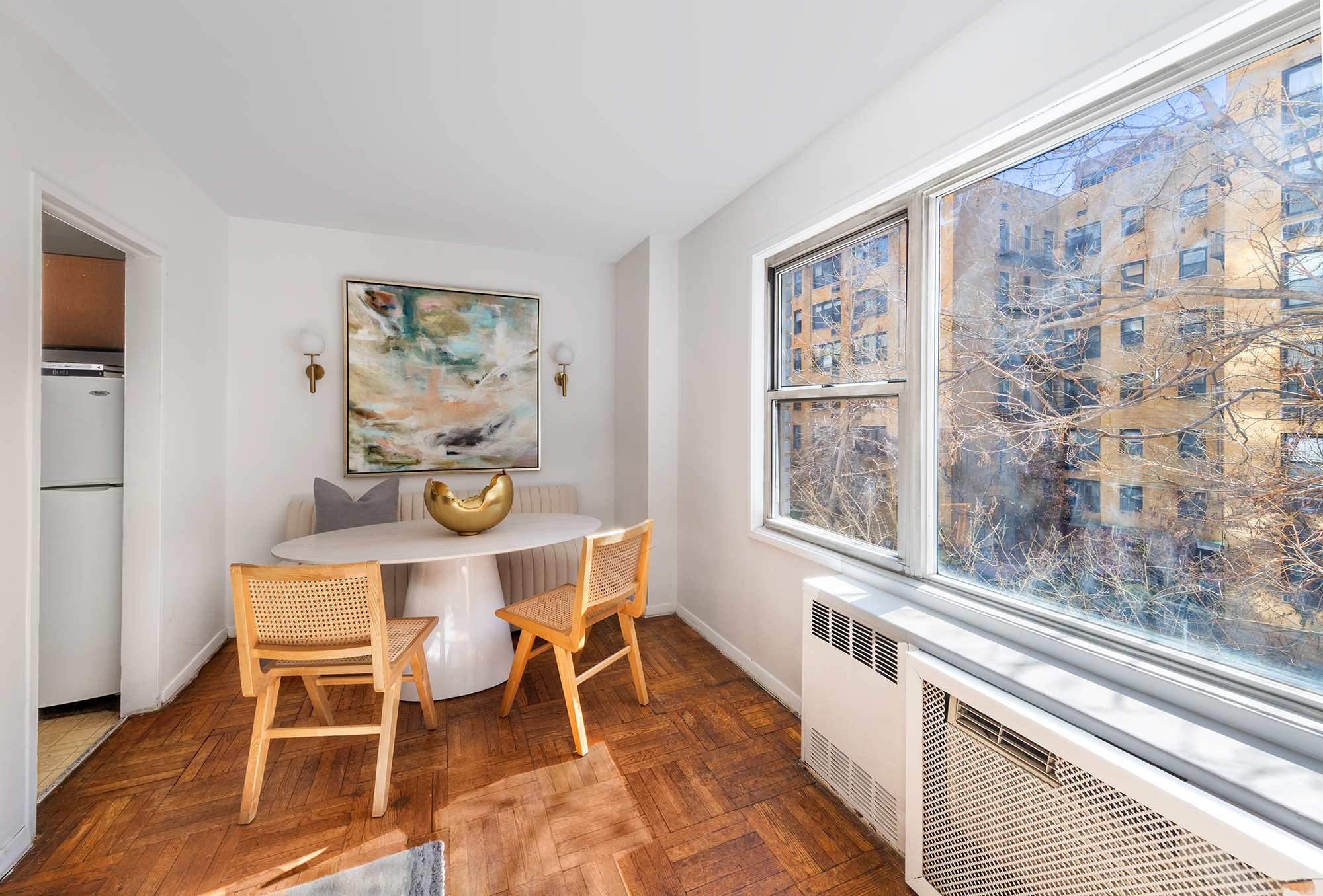 311 East 71st Street, Unit 3F Manhattan, NY 10021 - Photo 2 of 6 a dining room with furniture and window