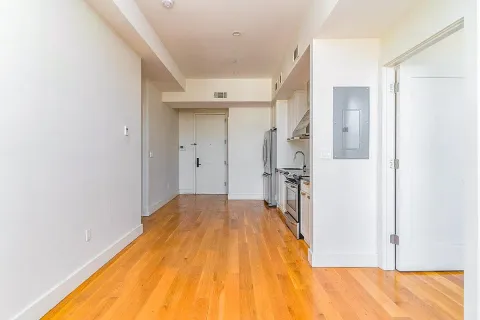 a view of a bathroom with a tub and shower