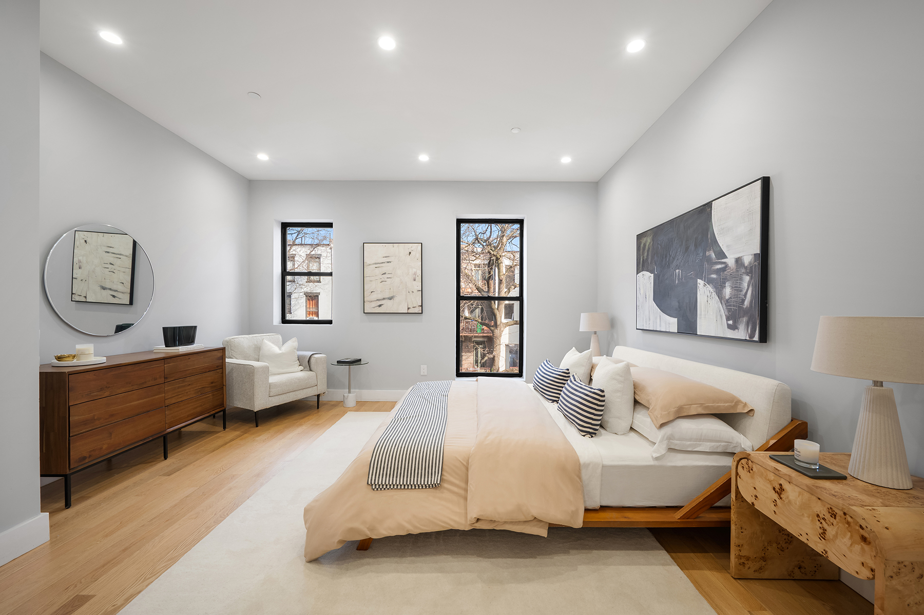 307 West 136th Street Manhattan, NY 10030 - Photo 8 of 26 a spacious bedroom with two beds and a couch