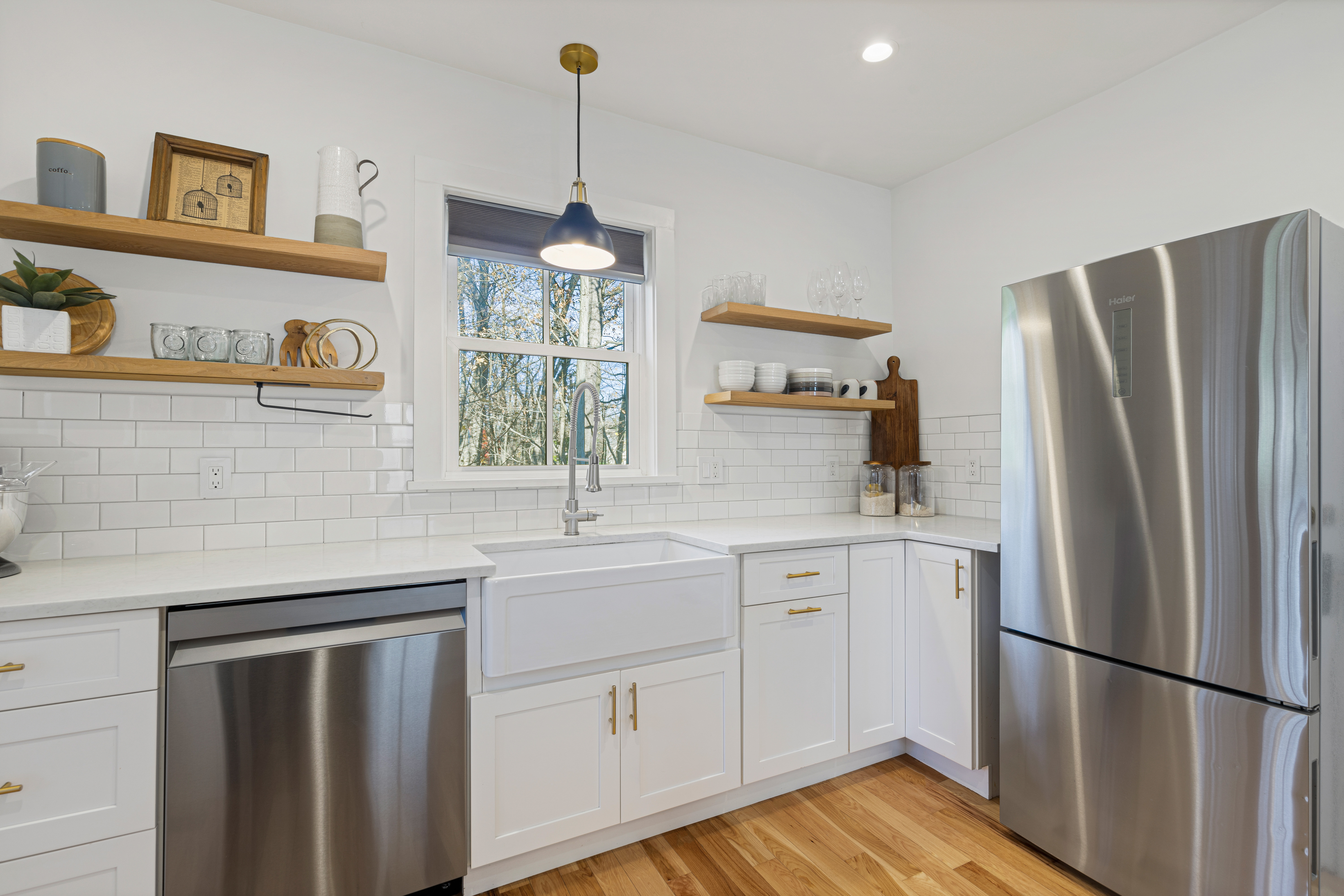 467 Midland Avenue Rye, NY 10580 - Photo 6 of 19 a kitchen with stainless steel appliances a refrigerator sink and cabinets