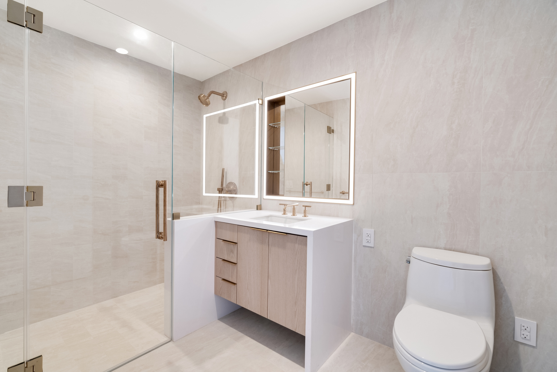 3 Court Square, Unit 2911 Queens, NY 11101 - Photo 11 of 22 a bathroom with a toilet a sink a tub and mirror