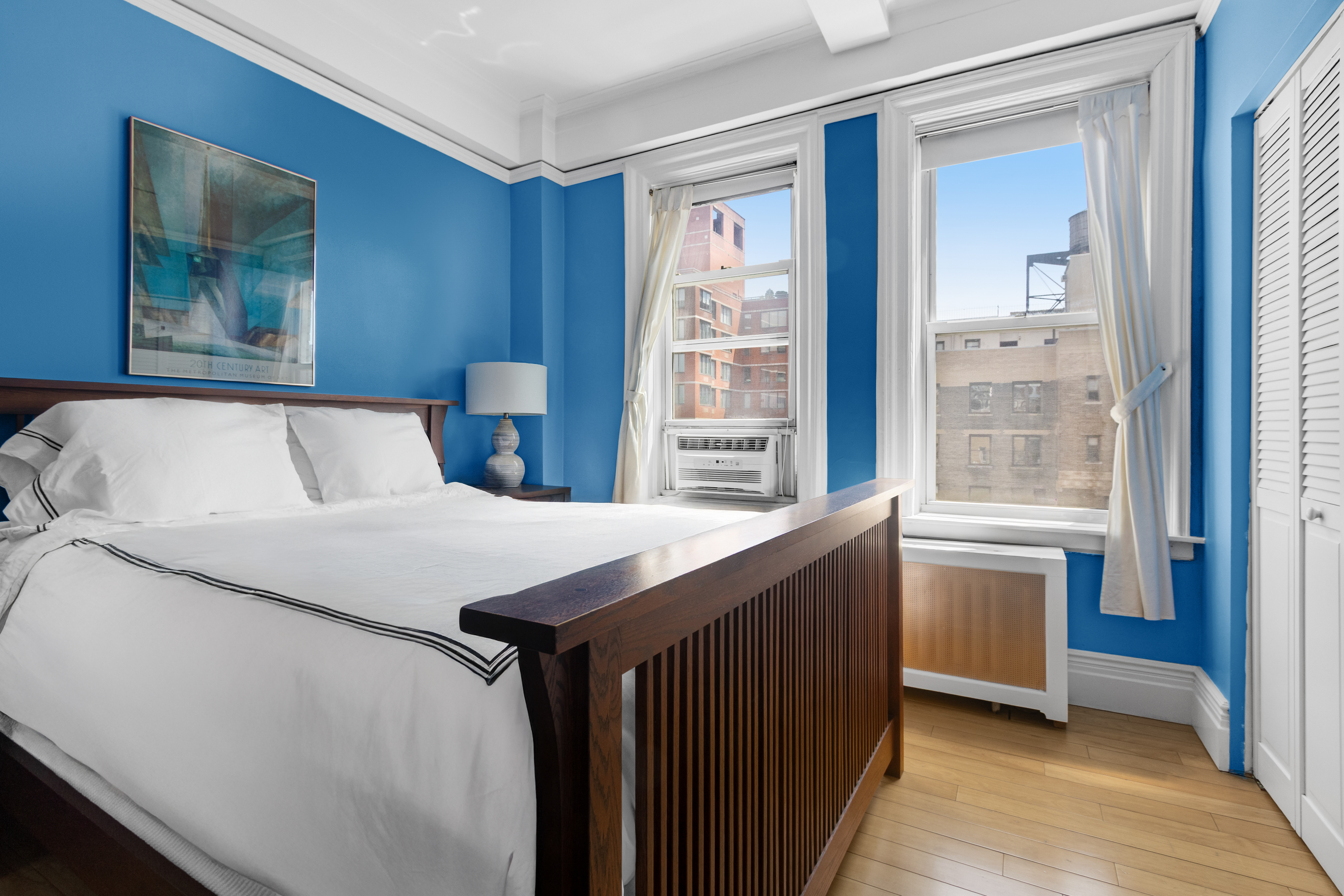 588 West End Avenue, Unit 16D Manhattan, NY 10024 - Photo 6 of 12 a bedroom with a large bed and a window