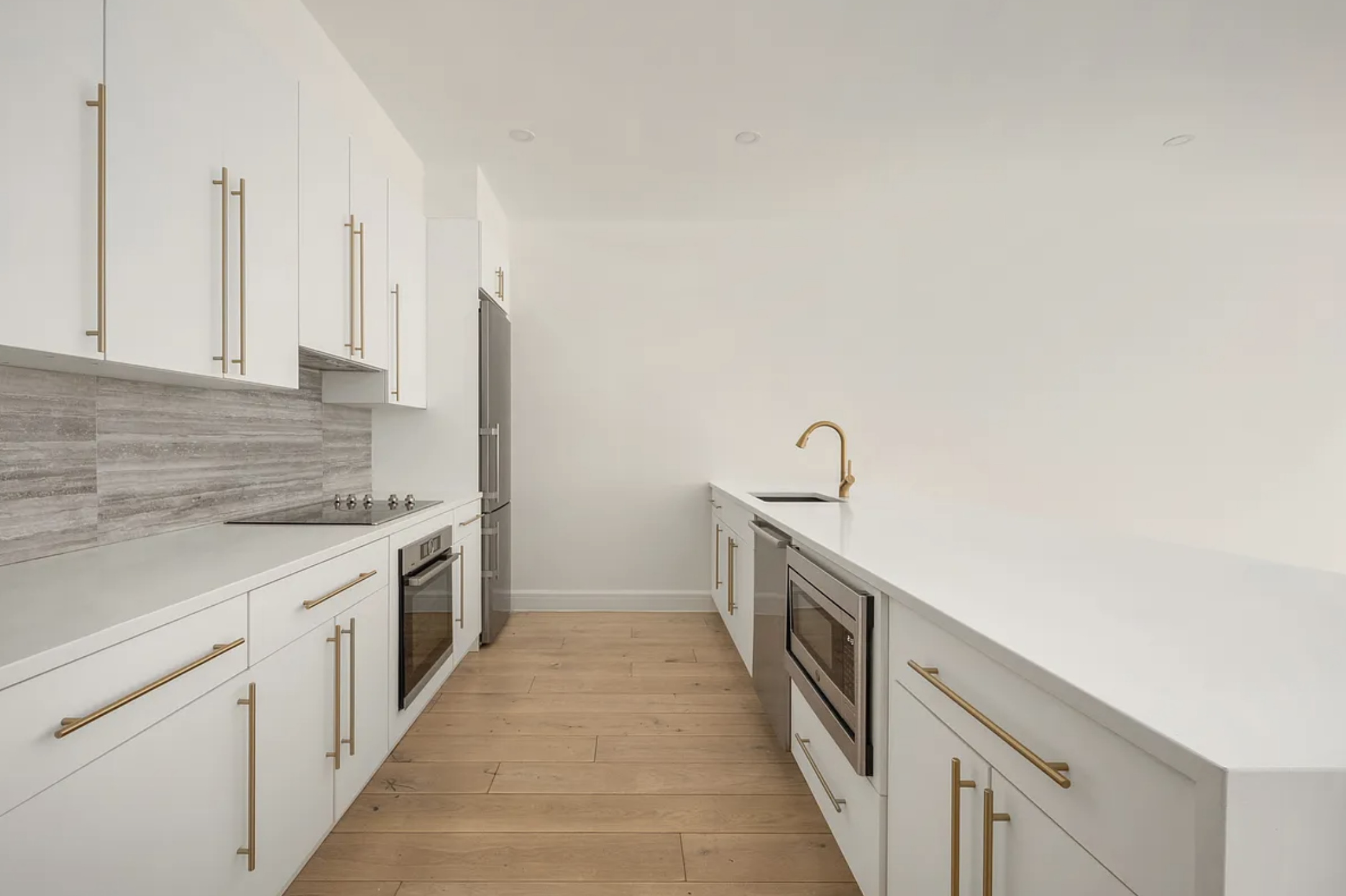 17 West 24th Street, Unit 4 Manhattan, NY 10010 - Photo 2 of 8 a kitchen with a sink and cabinets