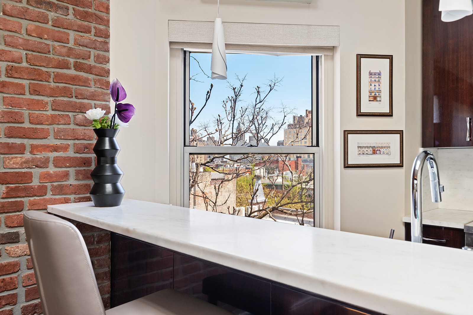77 Perry Street, Unit 6CD Manhattan, NY 10014 - Photo 7 of 16 a dining room with wall paintings and a large window