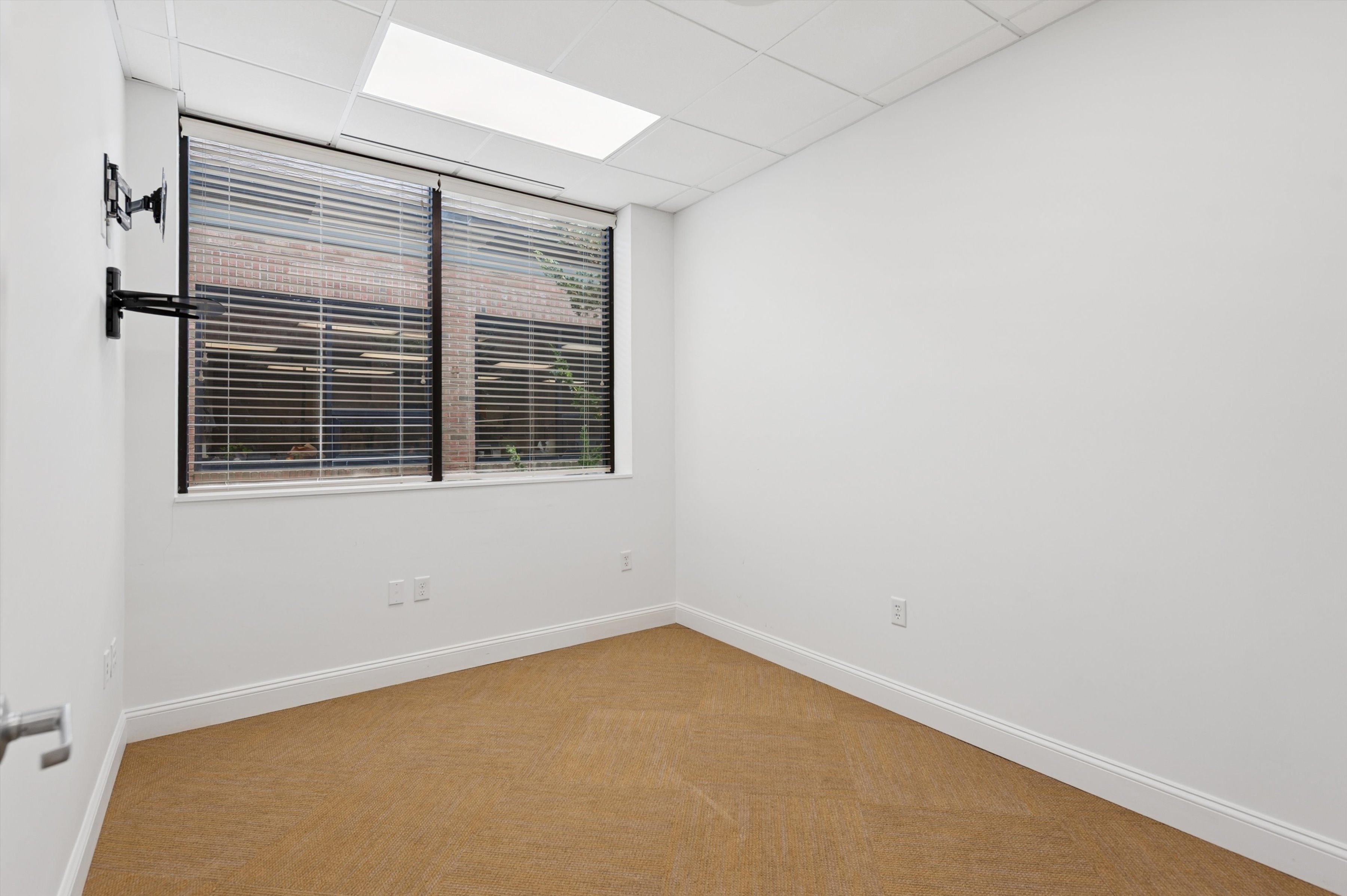 300 Pantigo Road East Hampton, NY 11937 - Photo 9 of 18 a view of an empty room with a window
