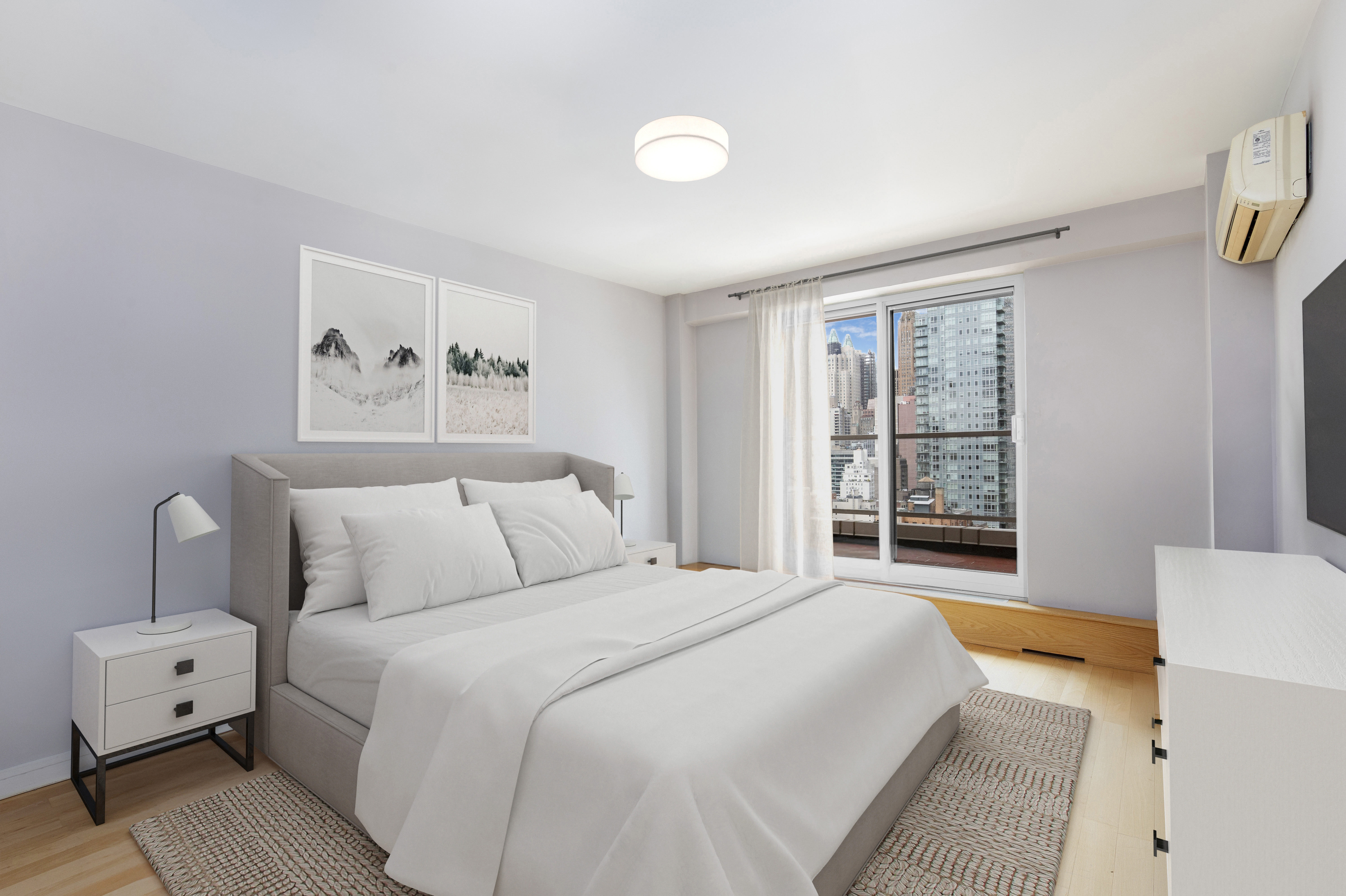 411 East 53rd Street, Unit 19D Manhattan, NY 10022 - Photo 4 of 13 a bedroom with a large bed and a window