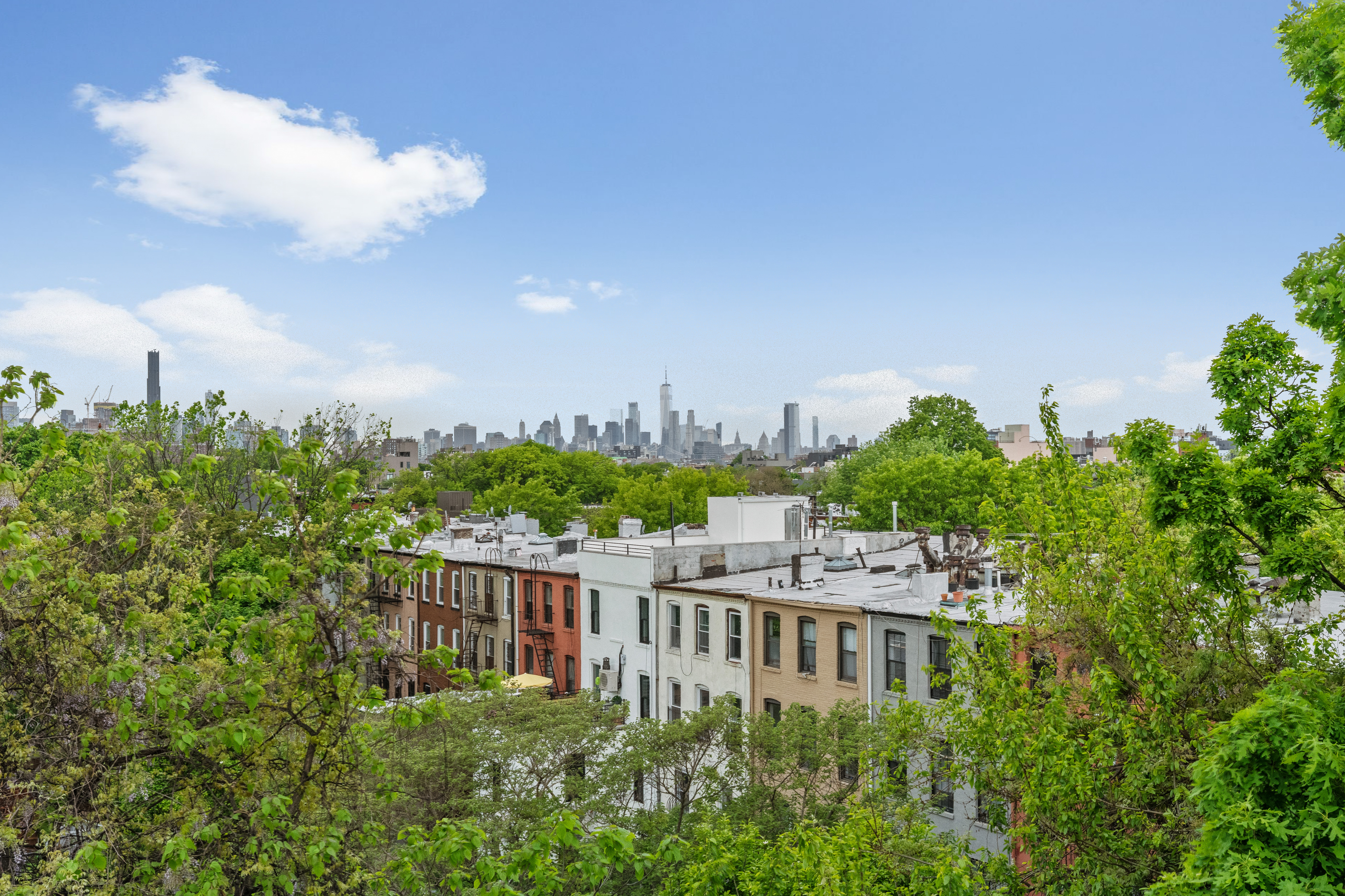 545 Lexington Avenue, Unit 2 Brooklyn, NY 11221 - Photo 18 of 23 a view of a residential apartment building with a yard