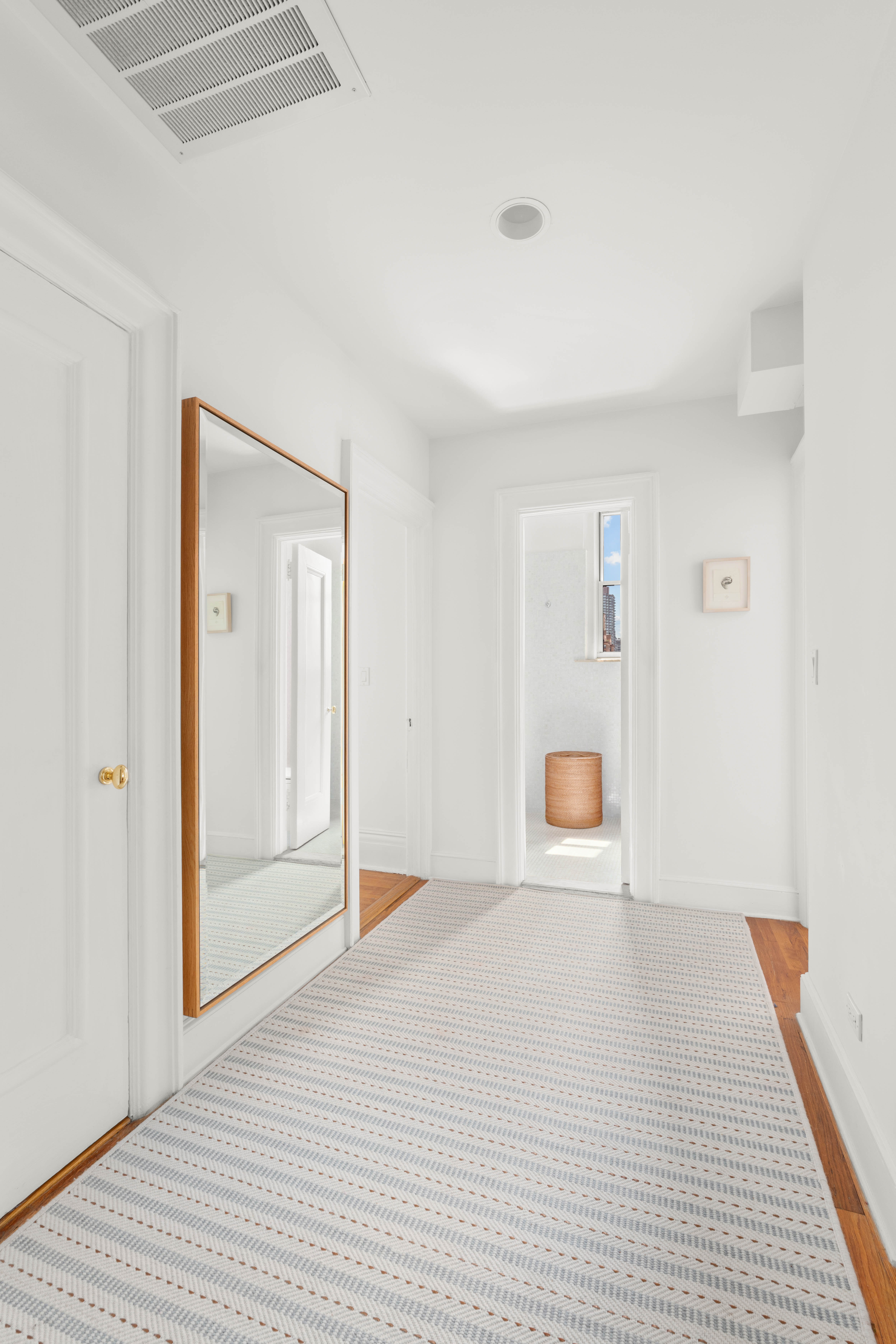 875 Park Avenue, Unit 9A Manhattan, NY 10075 - Photo 8 of 14 a view of an empty room with wooden floor