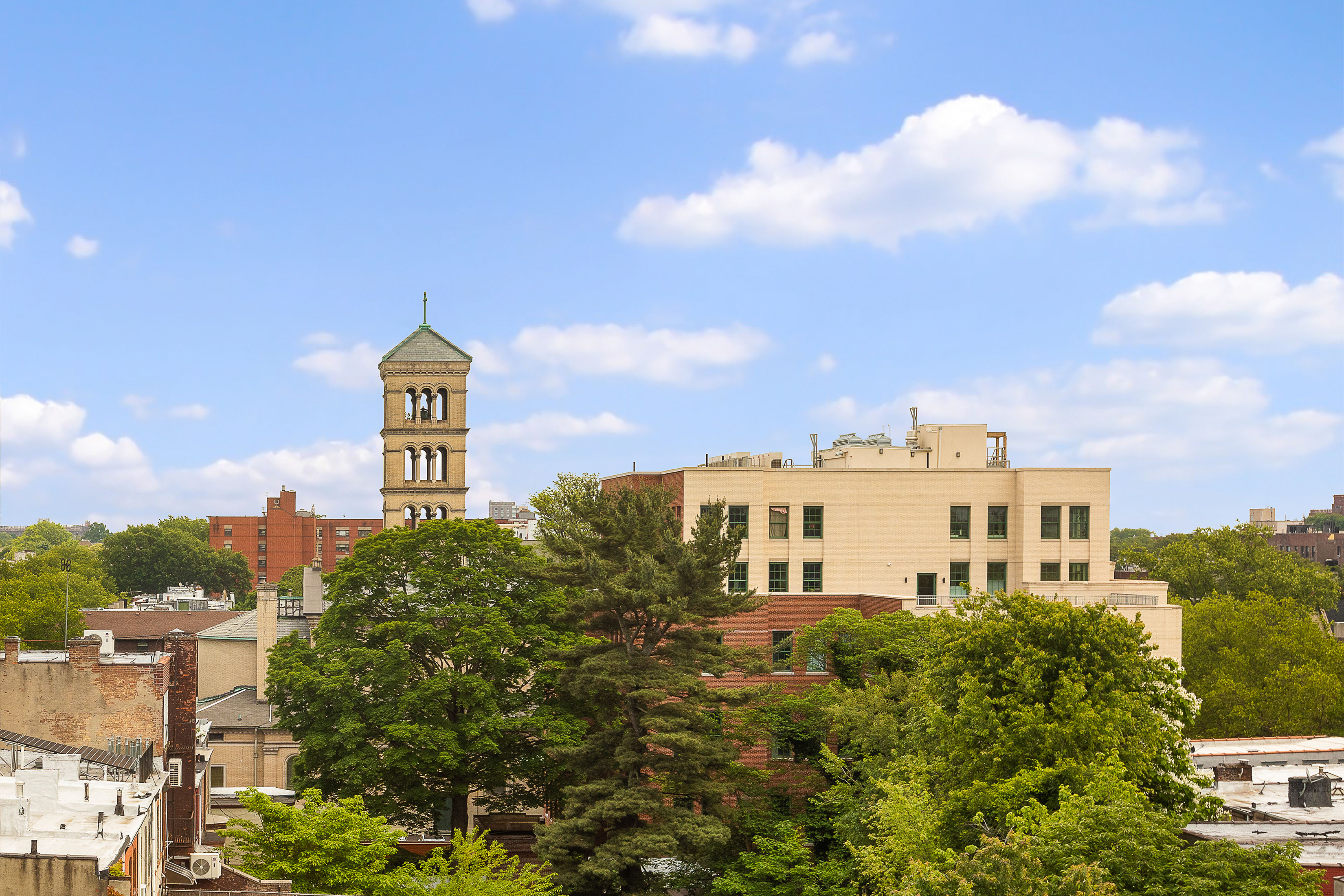 960 Sterling Place, Unit 6J Brooklyn, NY 11213 - Photo 9 of 11 a blue sign board with buildings in the background