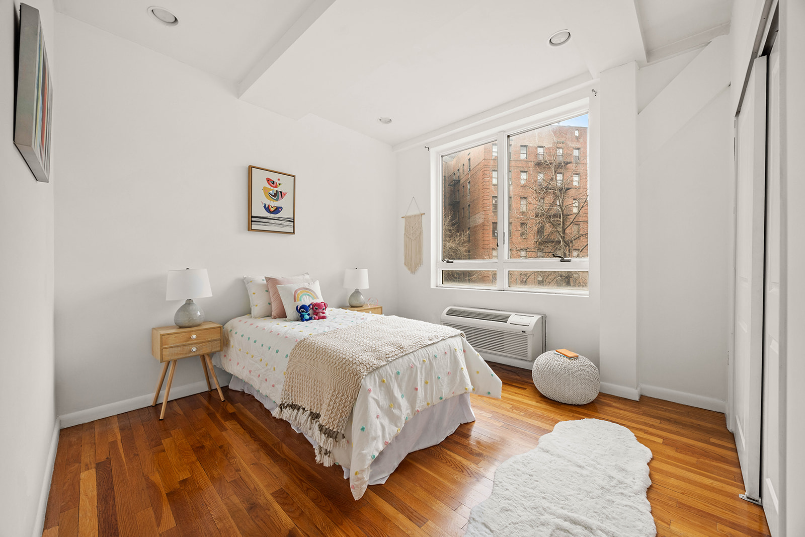 2233 Caton Avenue, Unit 2C Brooklyn, NY 11226 - Photo 7 of 10 a bedroom with a bed and wooden floor