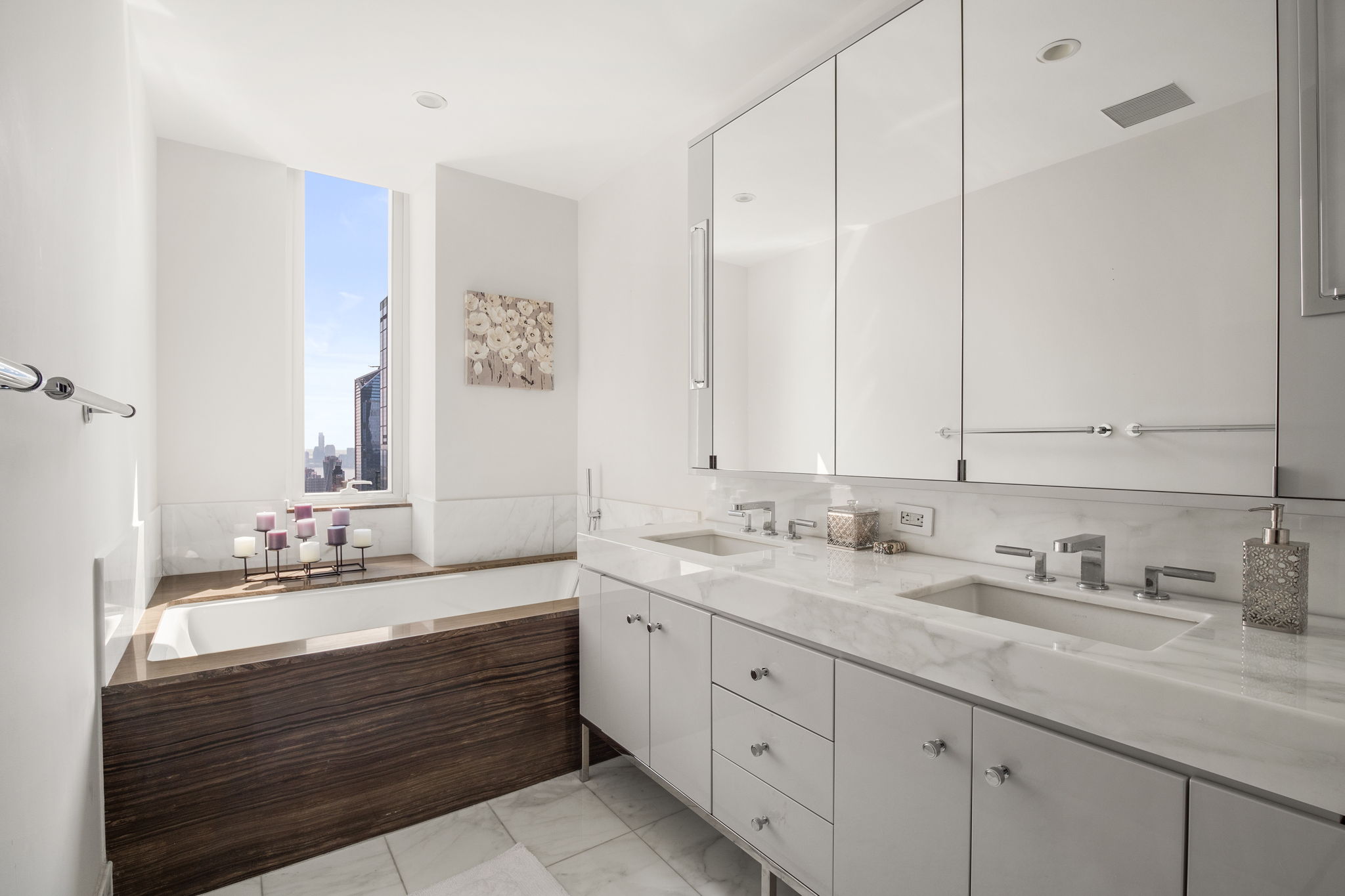 460 West 42nd Street, Unit 55F Manhattan, NY 10036 - Photo 5 of 9 a bathroom with a sink double vanity and a mirror