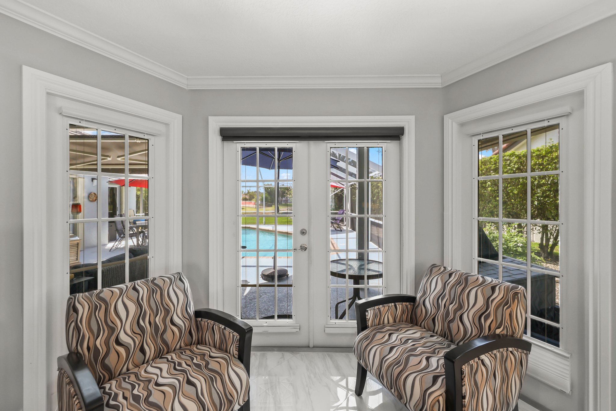 20317 Hacienda Court Boca Raton, FL 33498 - Photo 29 of 100 a living room with furniture and two large windows