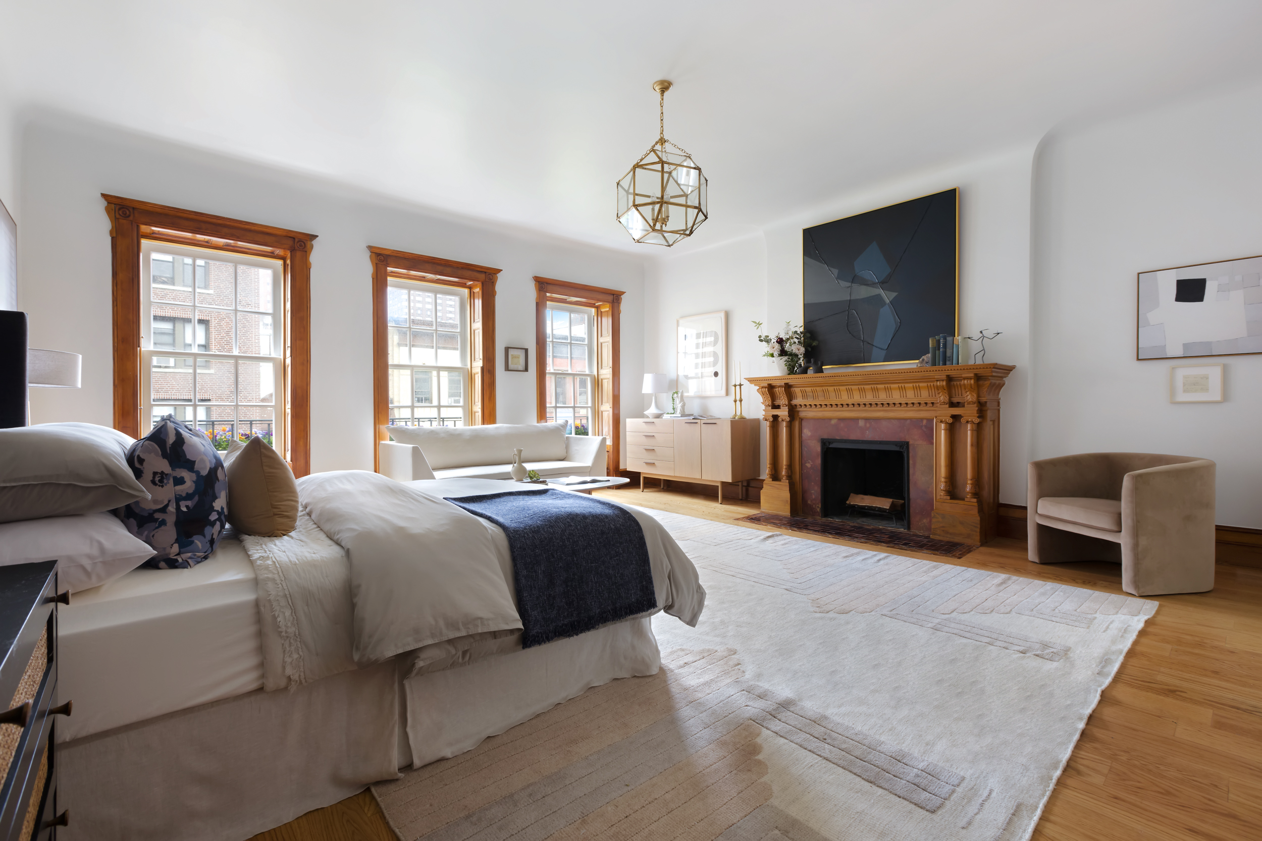 37 West 70th Street Manhattan, NY 10023 - Photo 37 of 41 a living room with furniture a fireplace and a flat screen tv