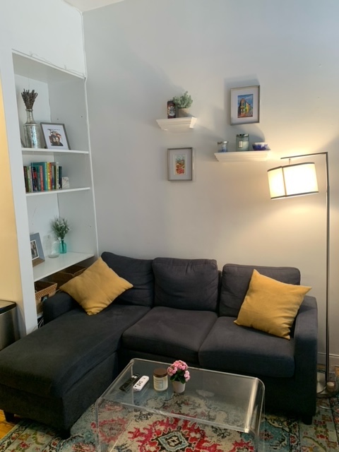 143 Sullivan Street, Unit 12 Manhattan, NY 10012 - Photo 2 of 11 a living room with furniture and a couch