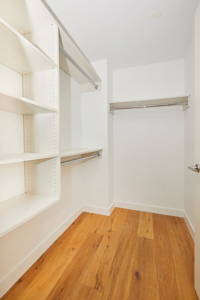 23 West 116th Street, Unit 8A Manhattan, NY 10026 - Photo 11 of 28 a view of a room with shelf on the wall