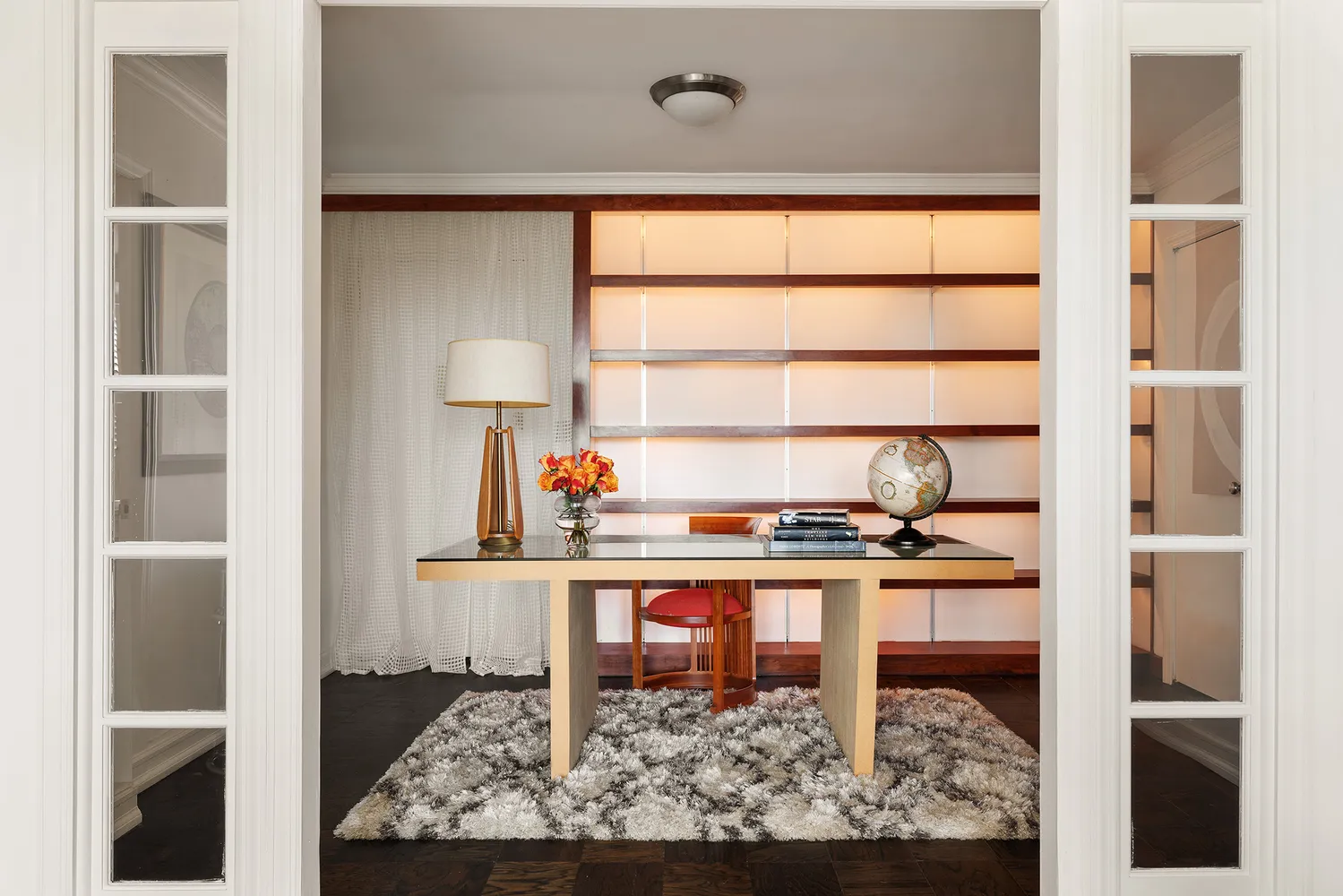 a kitchen with a sink cabinets and window