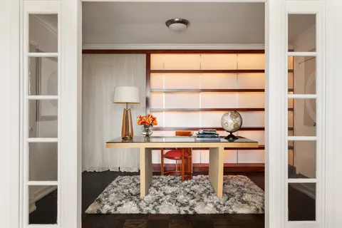a kitchen with a sink cabinets and window