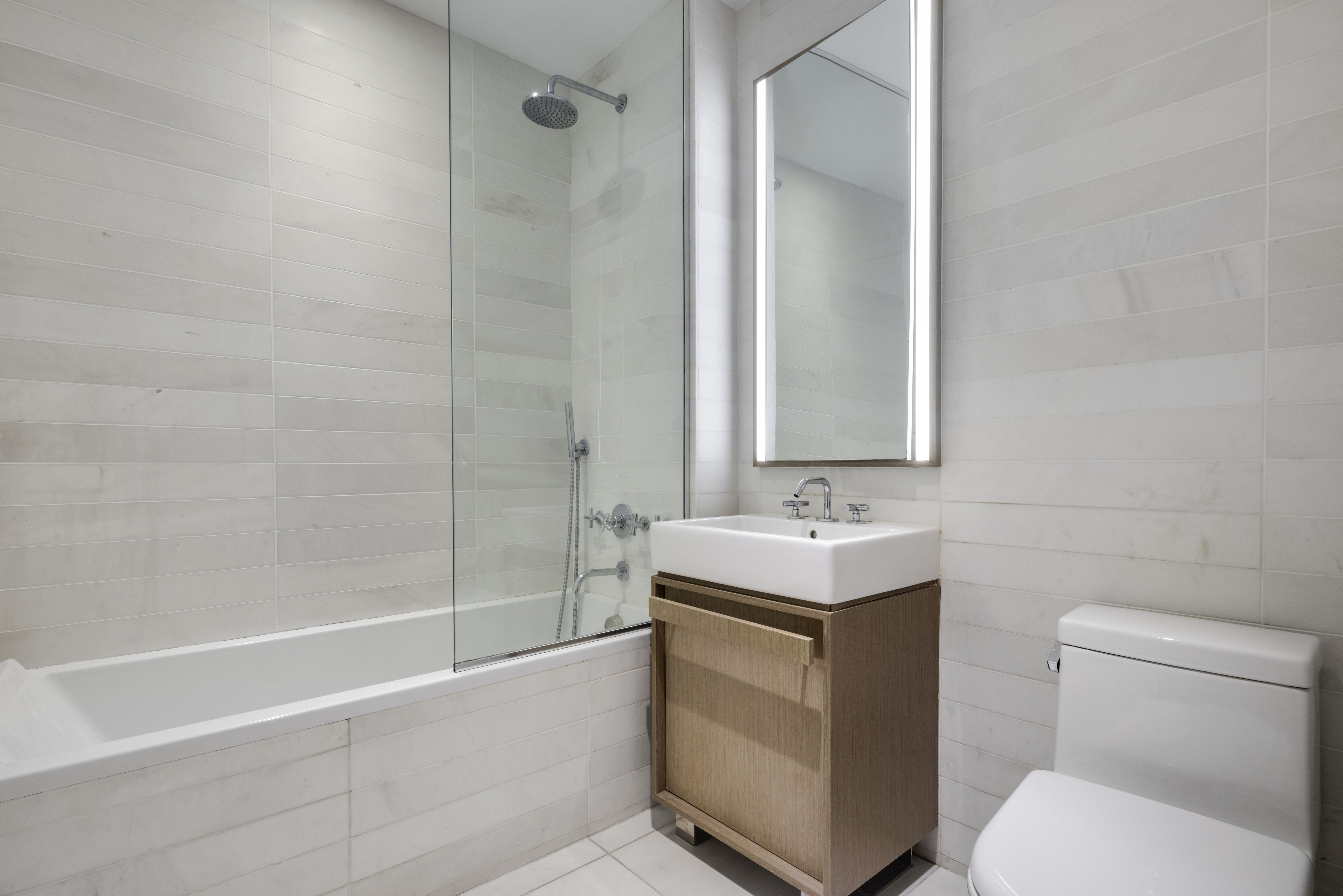 251 1st Street, Unit 1A Brooklyn, NY 11215 - Photo 5 of 12 a bathroom with a sink toilet and shower