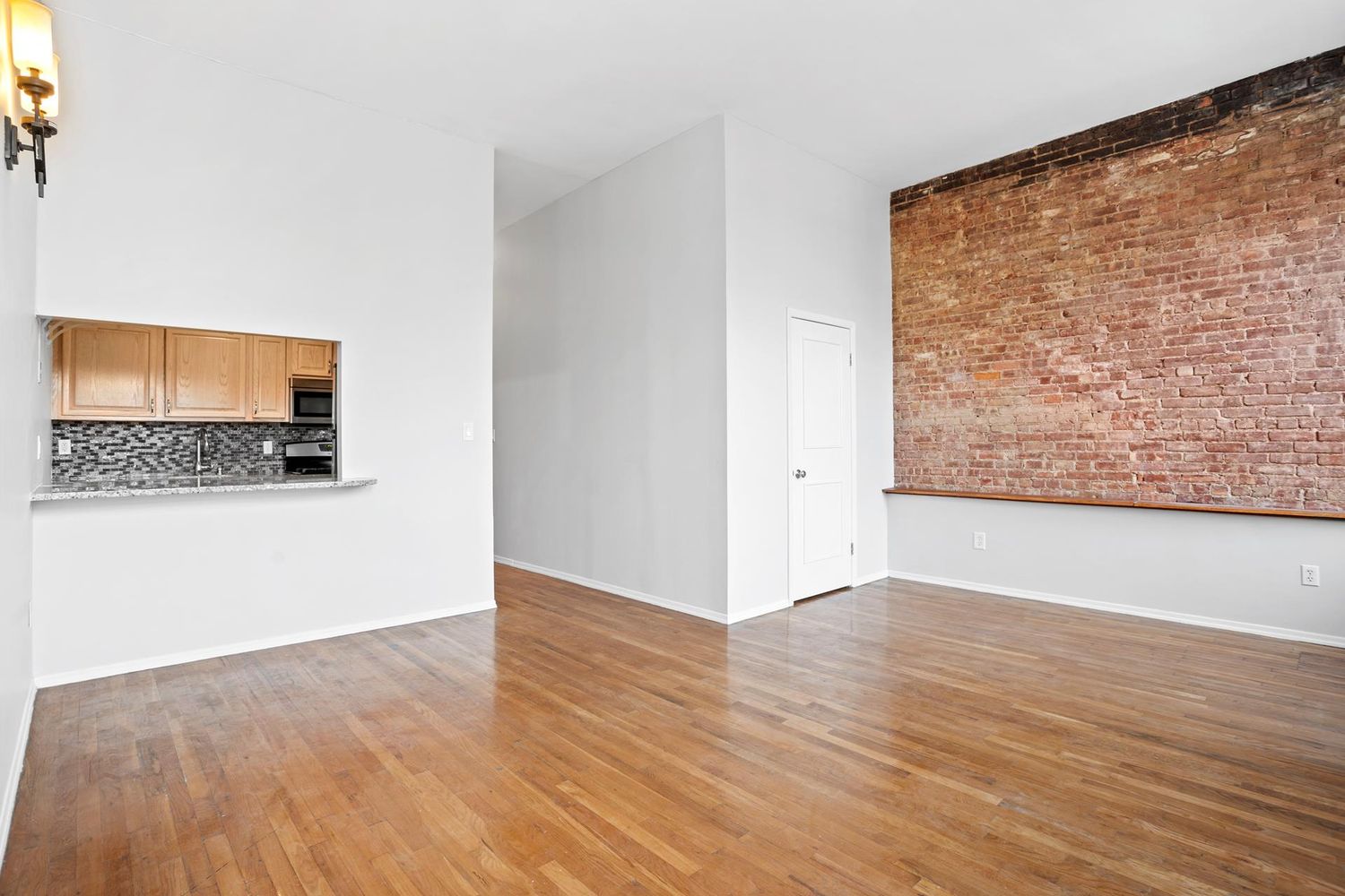 46 West 126th Street, Unit 3 Manhattan, NY 10027 - Photo 3 of 8 a view of an empty room and wooden floor