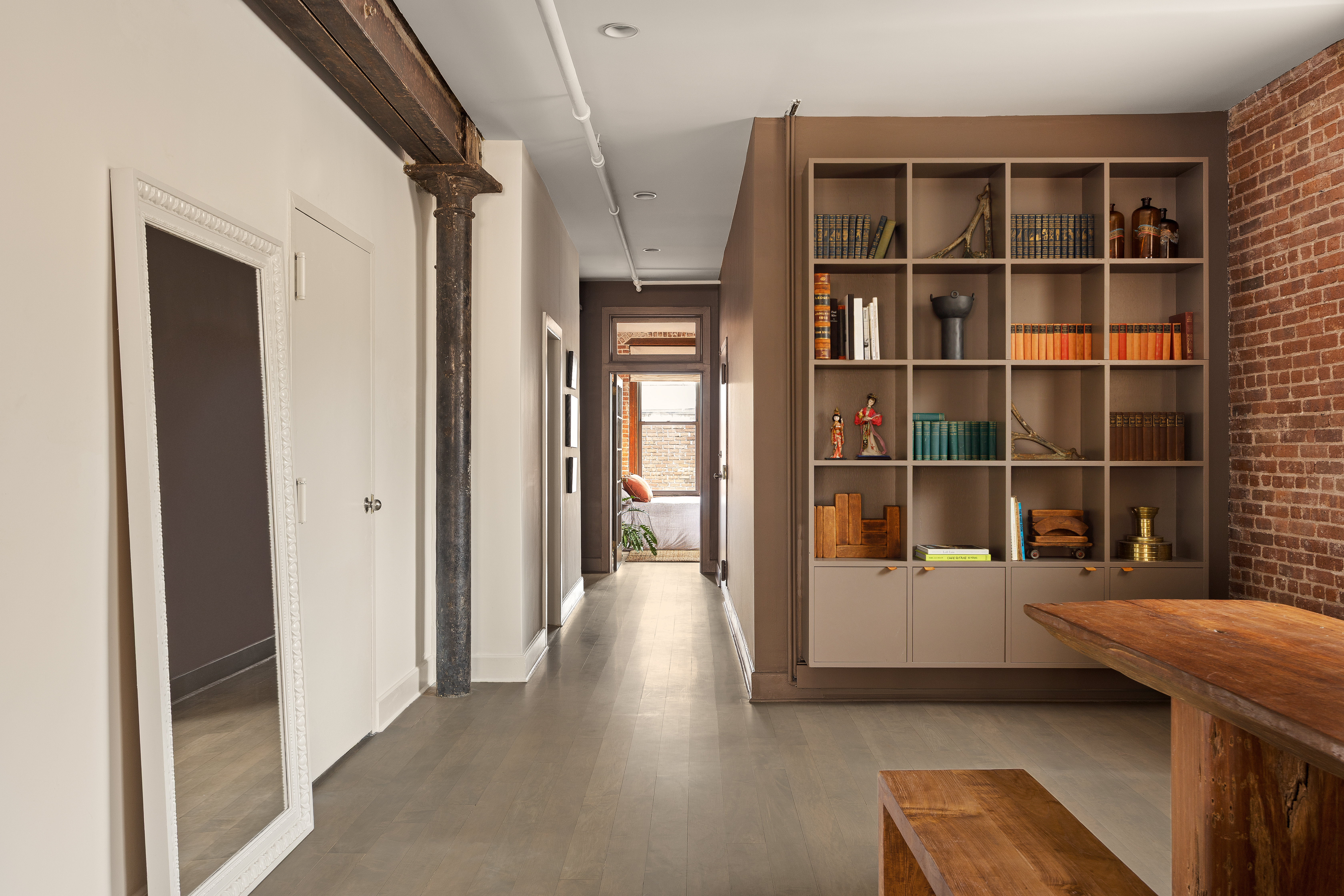 182 Lafayette Street, Unit 5 Manhattan, NY 10013 - Photo 10 of 19 a view of a bedroom with wooden floor and windows